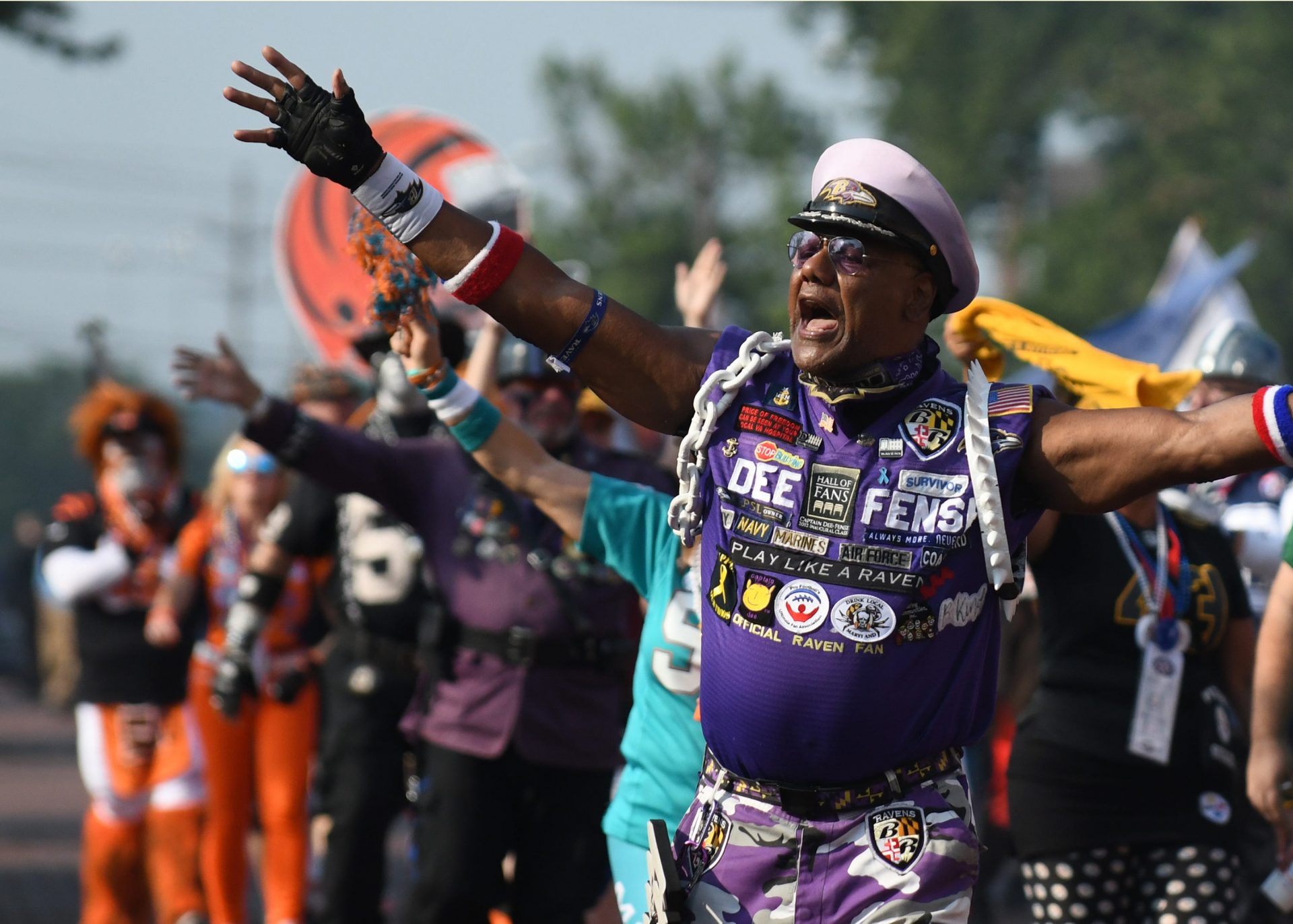 Baltimore Ravens Fan Captain Dee Fense walks with the 12th Man Float sponsored by Akron Auto Auction in the 2021 Pro Football Hall of Fame Canton Repository Grand Parade.  Saturday,  August 07, 2021

Grand Parade Hof 114
