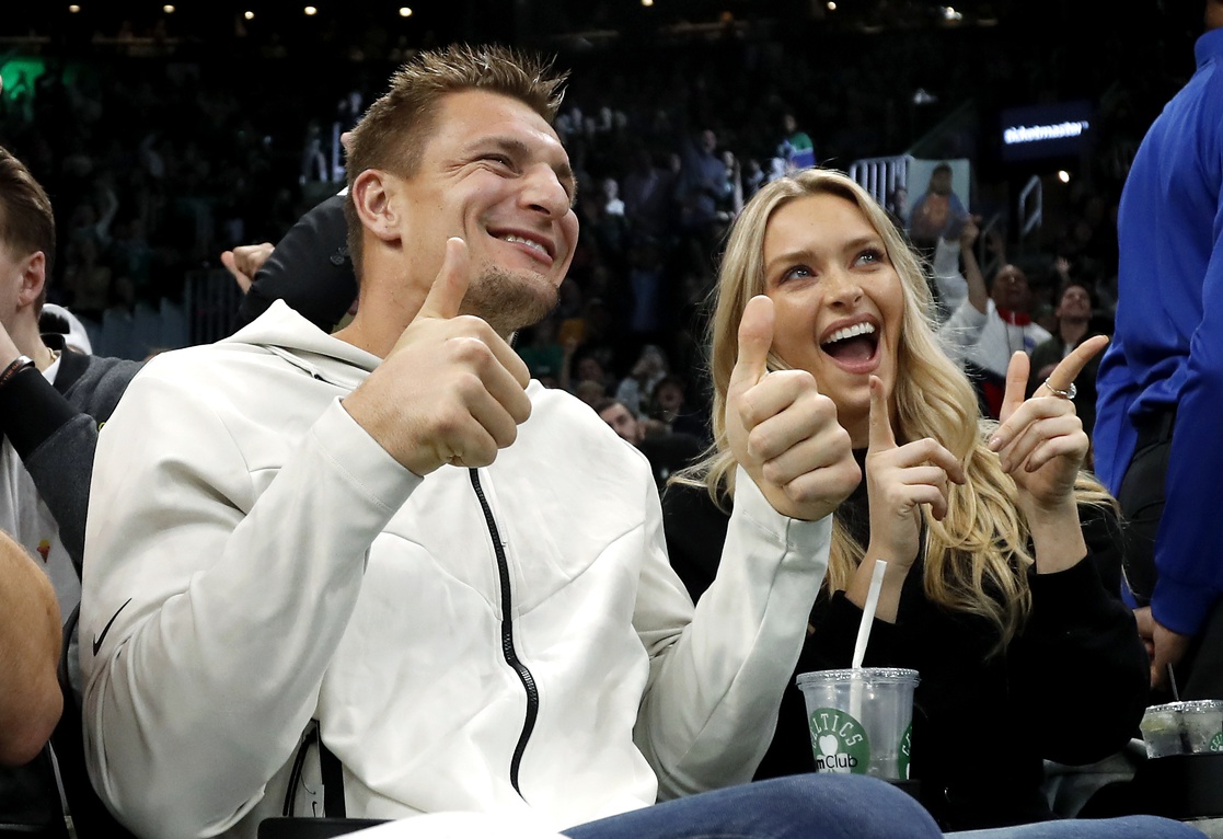 Former New England Patriots tight end Rob Gronkowski and his girlfriend, Sports Illustrated swimsuit model Camille Kostek pose for the Jumbotron during the second half of the game between the Boston Celtics and the Denver Nuggets at TD Garden.