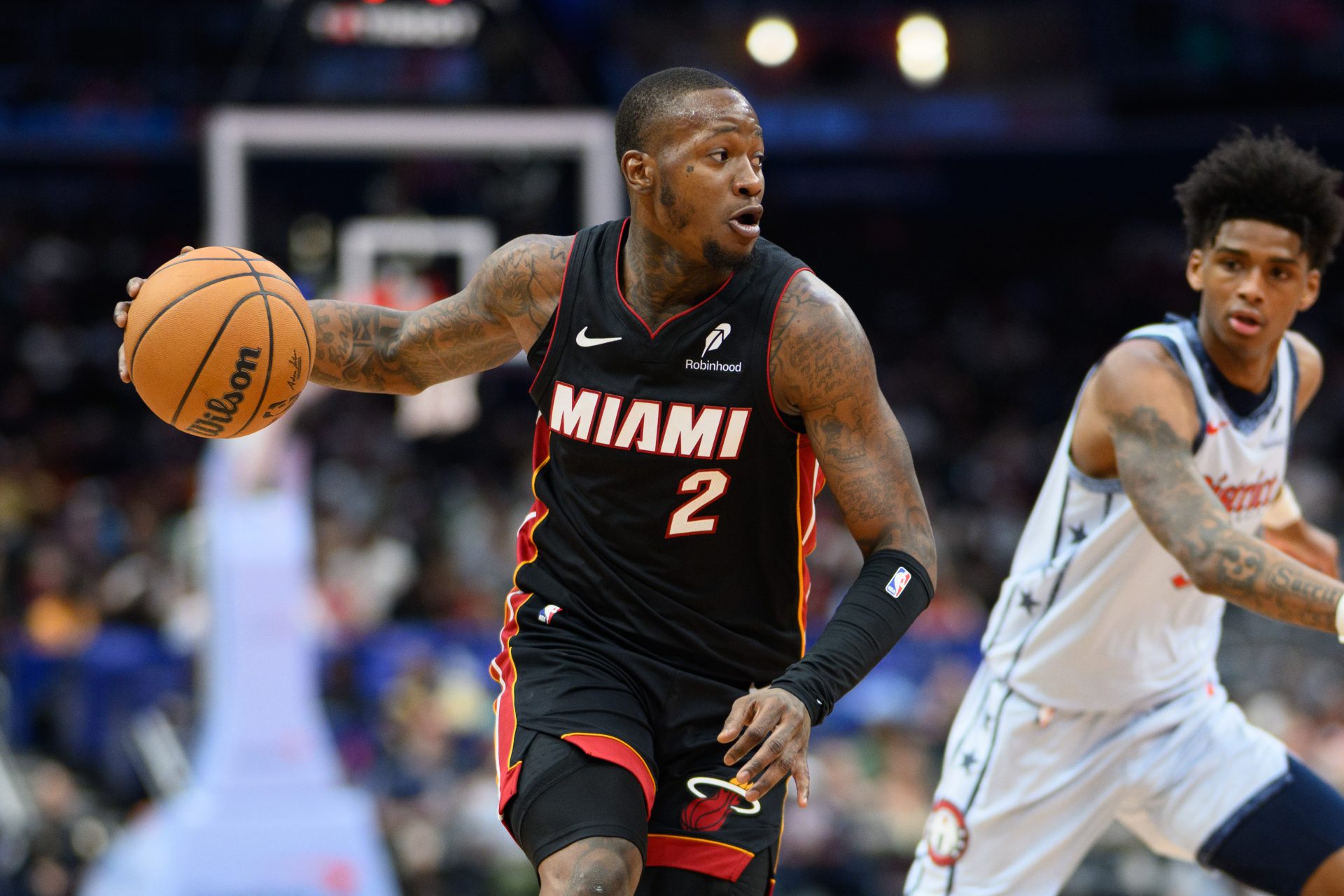 Miami Heat guard Terry Rozier (2) drives to the basket against Washington Wizards guard AJ Johnson (5) during the first quarter at Capital One Arena.