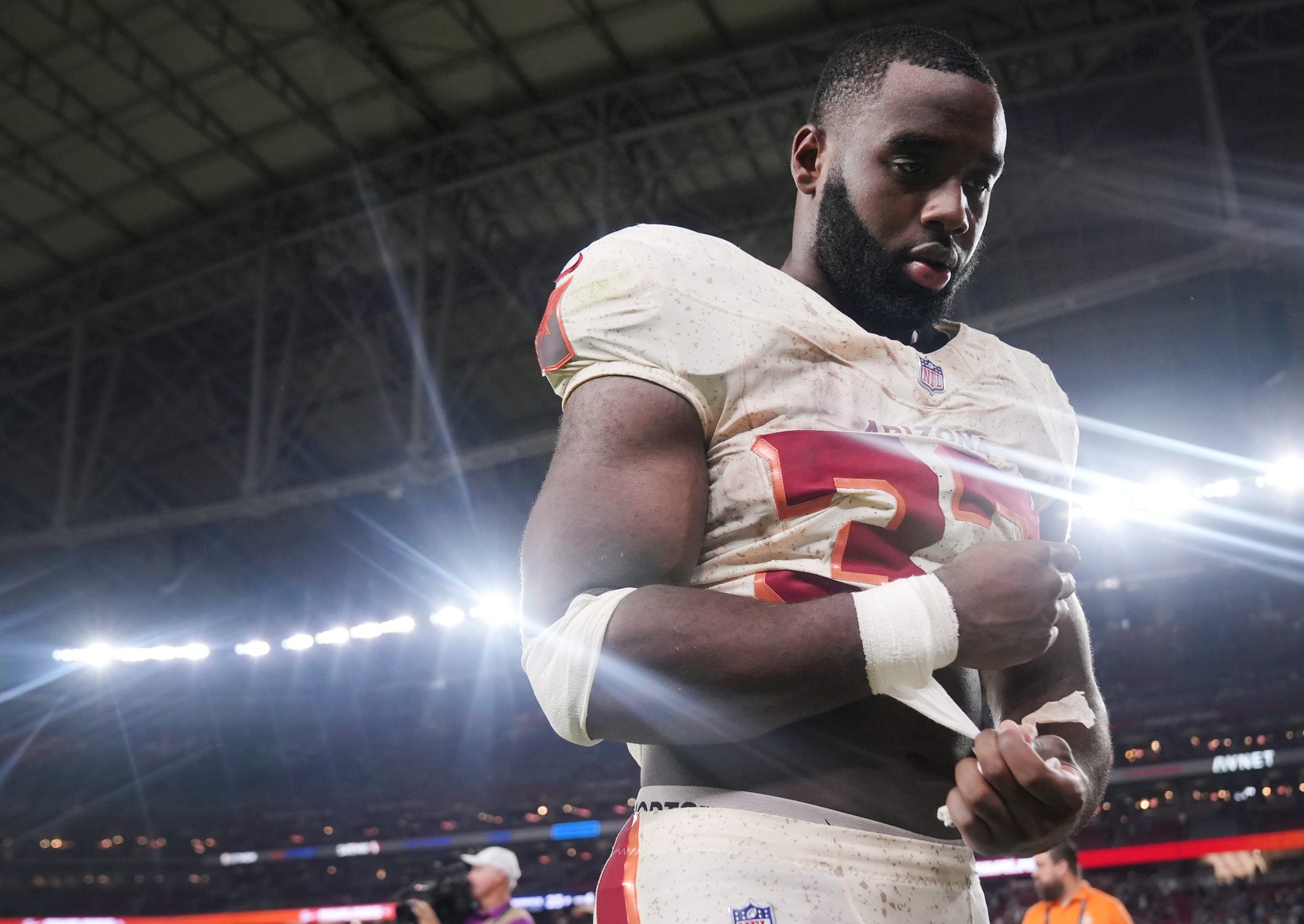 Arizona Cardinals running back Trey Benson (33) walks off the field after their 23-20 loss to the Seattle Seahawks at State Farm Stadium in Glendale on Sept. 25, 2025.