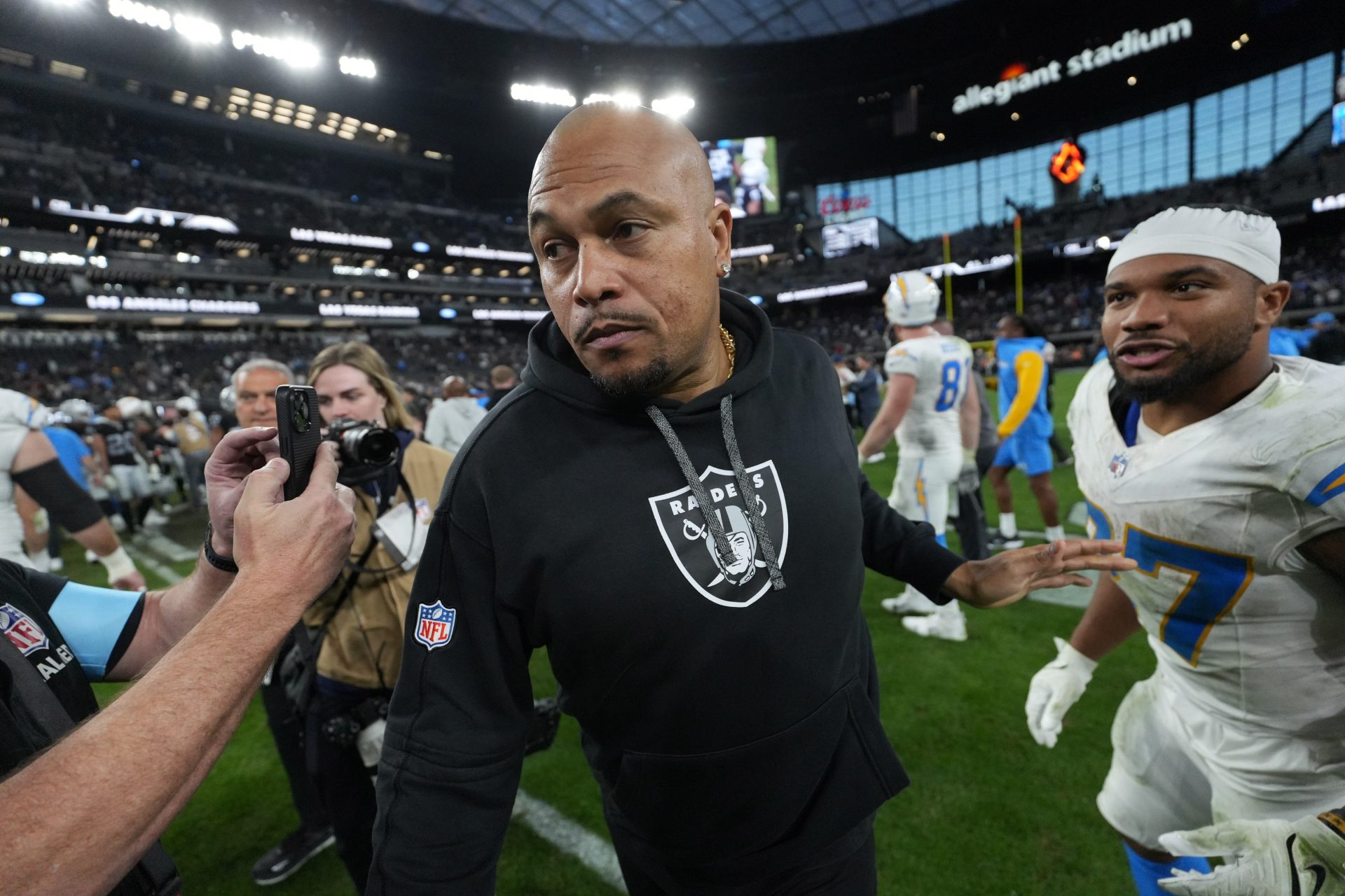 Las Vegas Raiders coach Antonio Pierce leaves the field after the game against the Los Angeles Chargers at Allegiant Stadium.