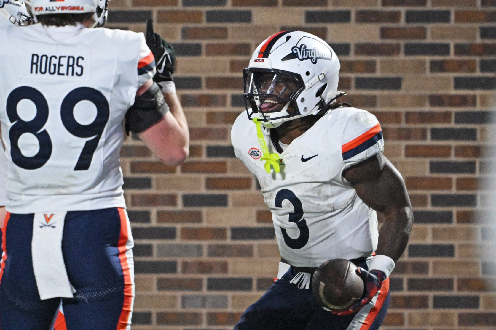 Virginia Cavaliers running back J'Mari Taylor (3) celebrates after scoring a touchdown during the third quarter against the Duke Blue Devils at Wallace Wade Stadium.