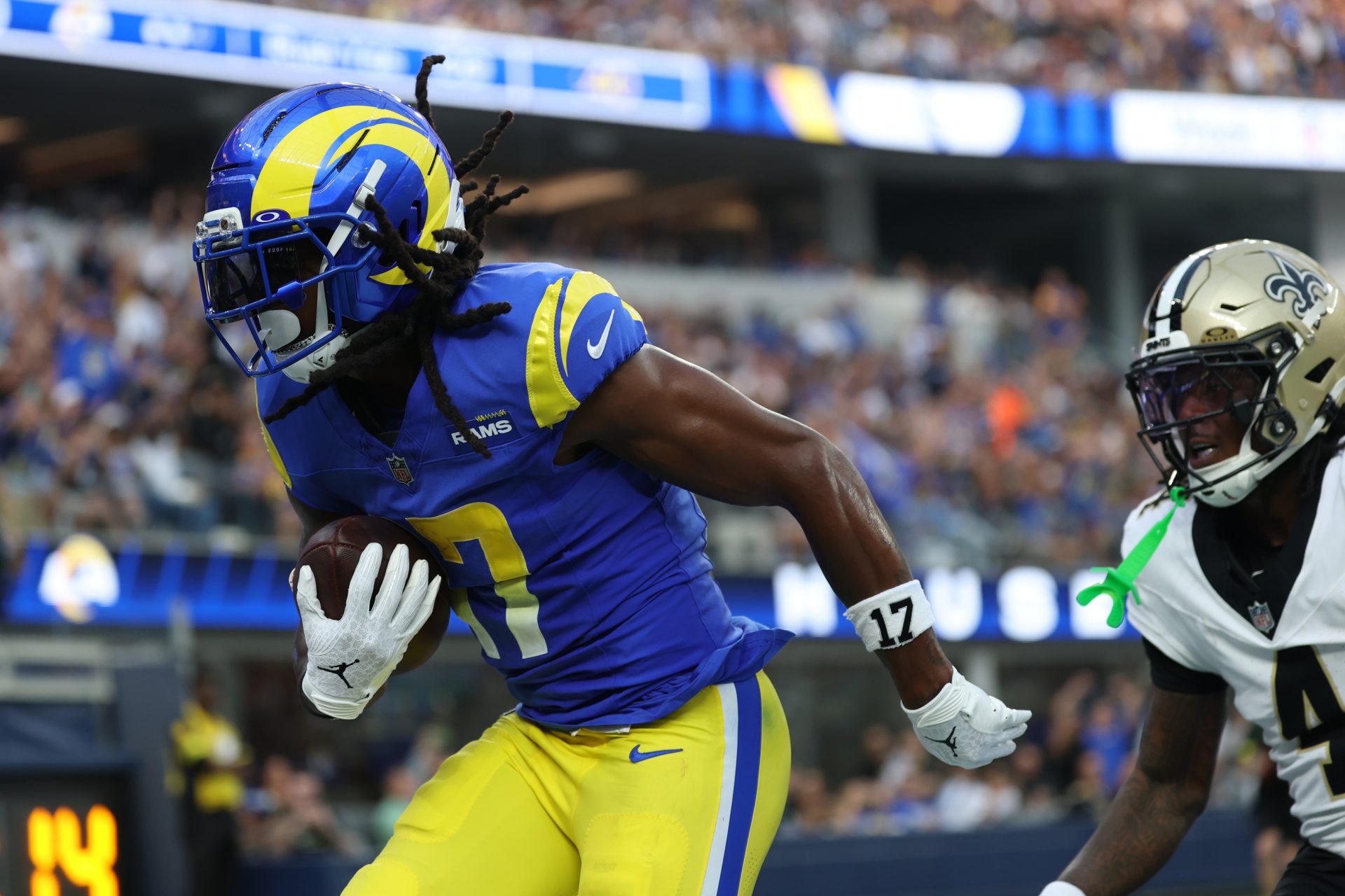 Los Angeles Rams wide receiver Davante Adams (17) makes a touchdown catch in front of New Orleans Saints cornerback Kool-Aid McKinstry (4) during the second half at SoFi Stadium.