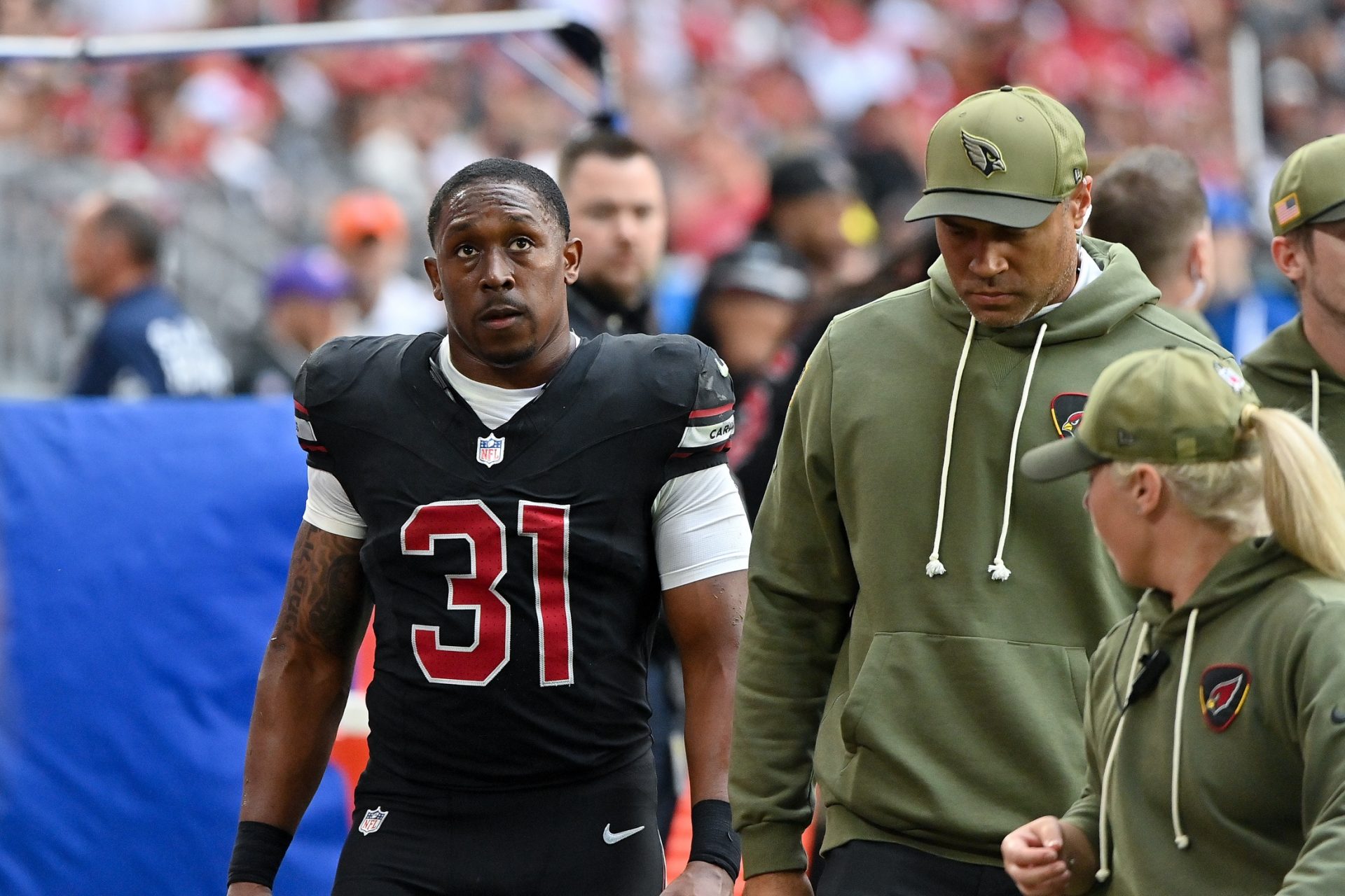 Arizona Cardinals running back Emari Demercado (31) exits the field during the first half against the San Francisco 49ers at State Farm Stadium.