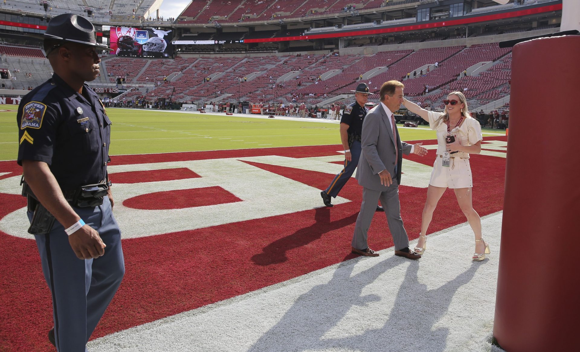 Alabama Crimson Tide head coach Nick Saban hugs his daughter, Kristen Setas before the game with Texas at Bryant-Denny Stadium.