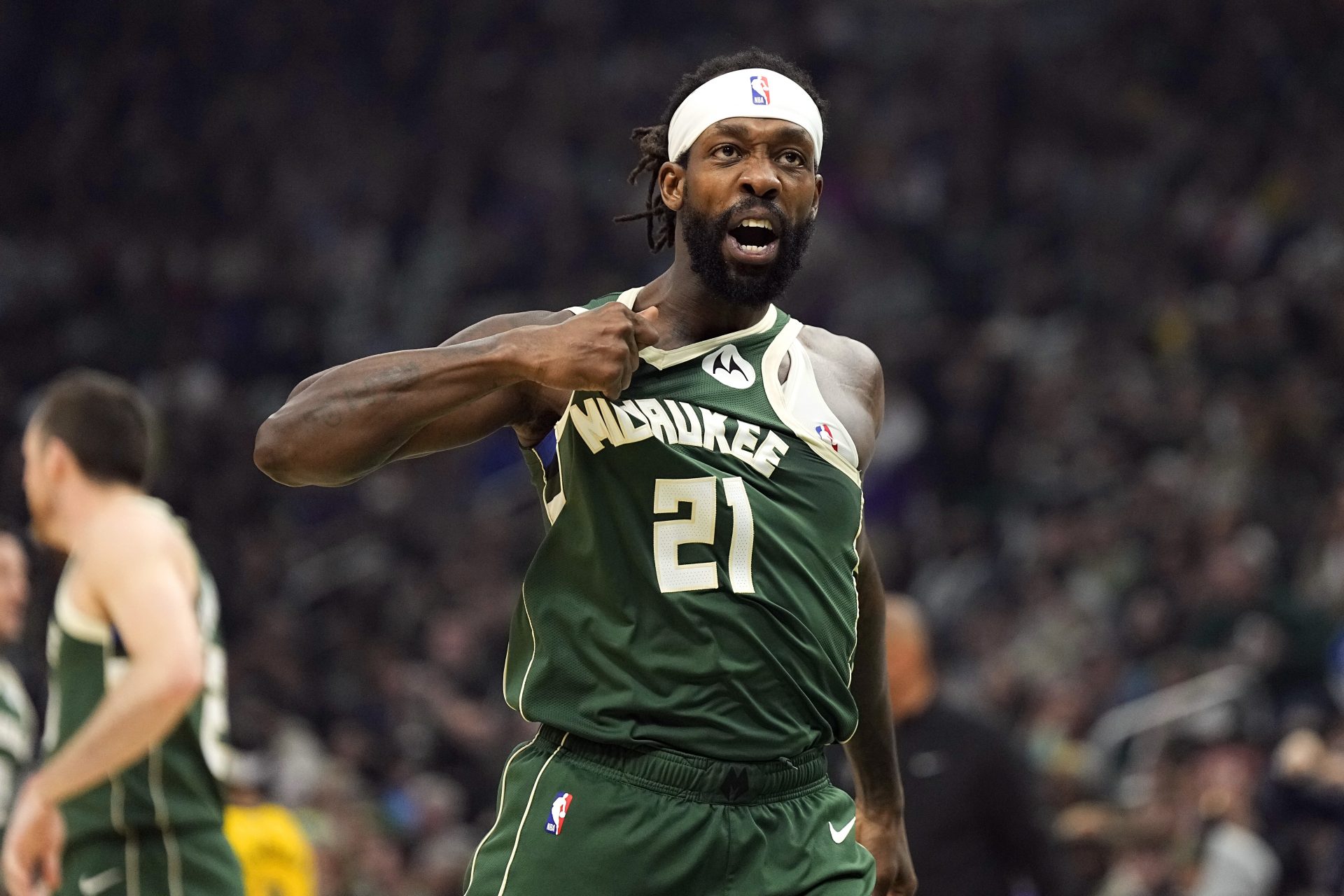 Milwaukee Bucks guard Patrick Beverley (21) gestures towards the crowd following a play during the second quarter against the Indiana Pacers during game five of the first round for the 2024 NBA playoffs at Fiserv Forum.