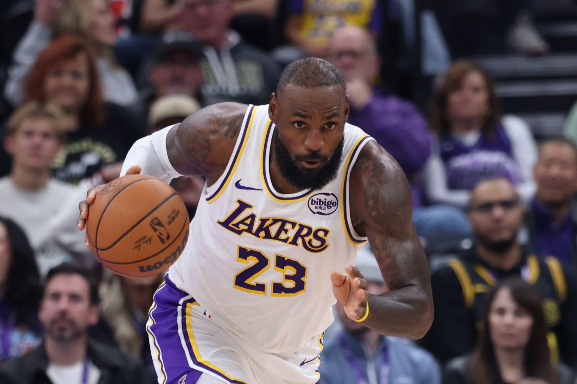 Los Angeles Lakers forward LeBron James (23) brings the ball up the court against the Utah Jazz during the first half at Delta Center.