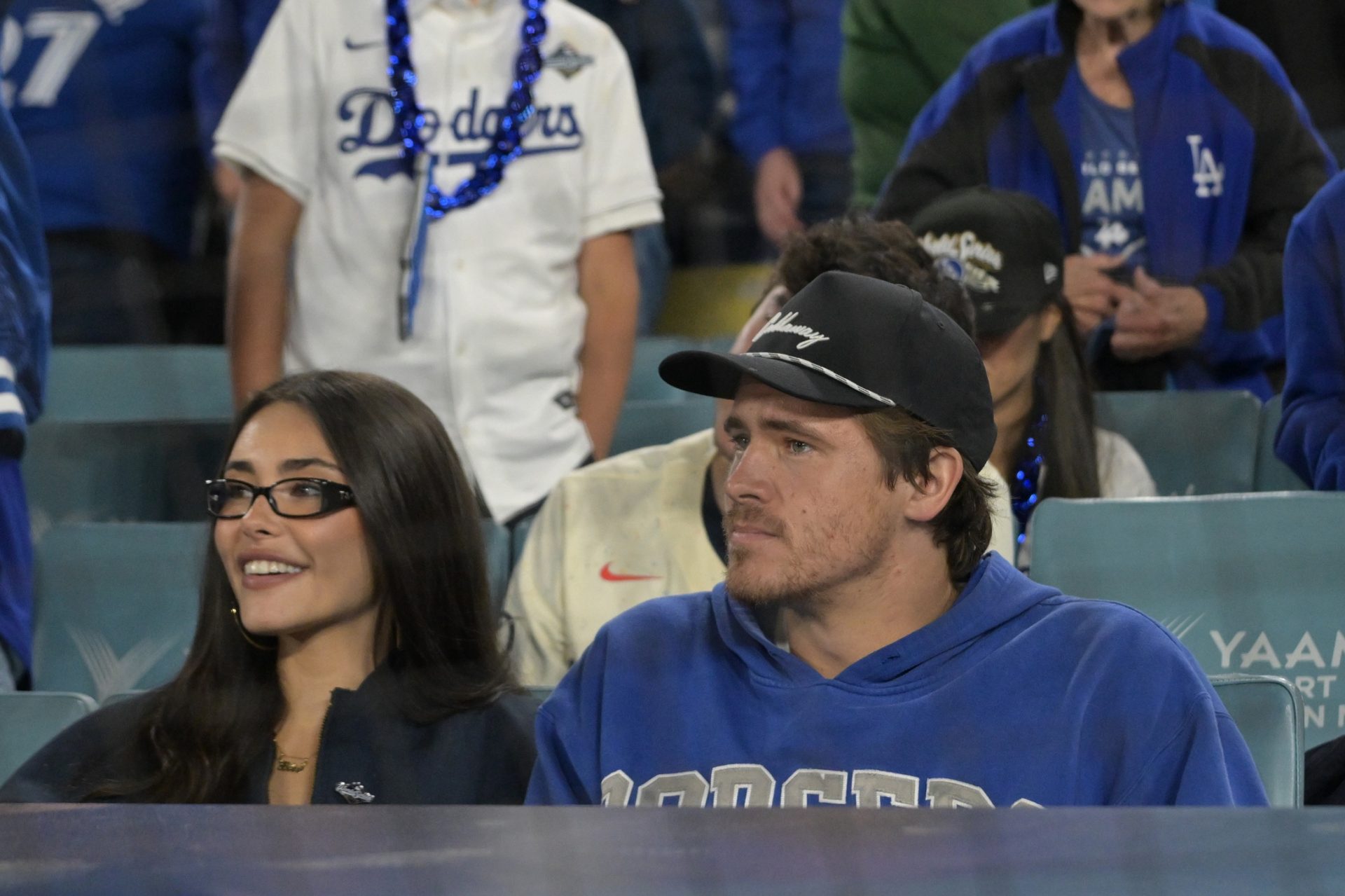 Los Angeles Chargers quarterback Justin Herbert with his girlfriend Madison Beer during game three of the 2025 MLB World Series between the Toronto Blue Jays and the Los Angeles Dodgers at Dodger Stadium.
