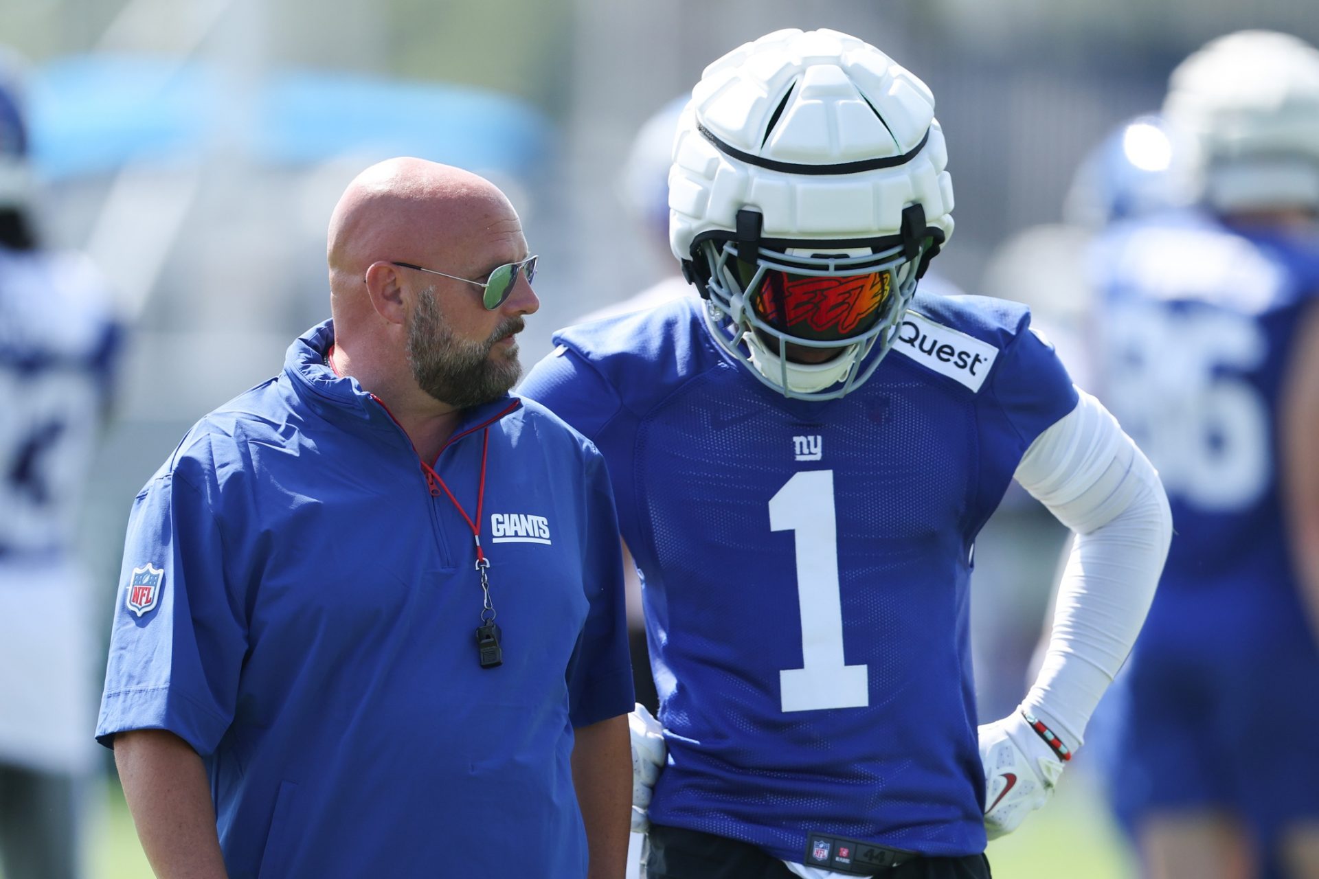 New York Giants head coach Brian Daboll talks with wide receiver Malik Nabers (1) during training camp at Quest Diagnostics Training Center.