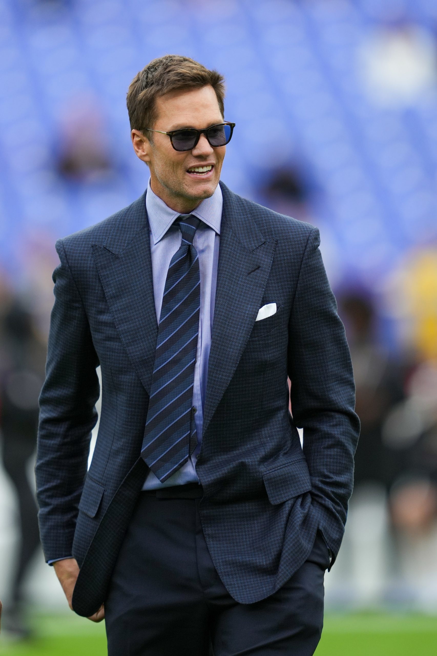 Fox Sports announcer Tom Brady looks on before the game between the Baltimore Ravens and the Los Angeles Rams at M&T Bank Stadium.