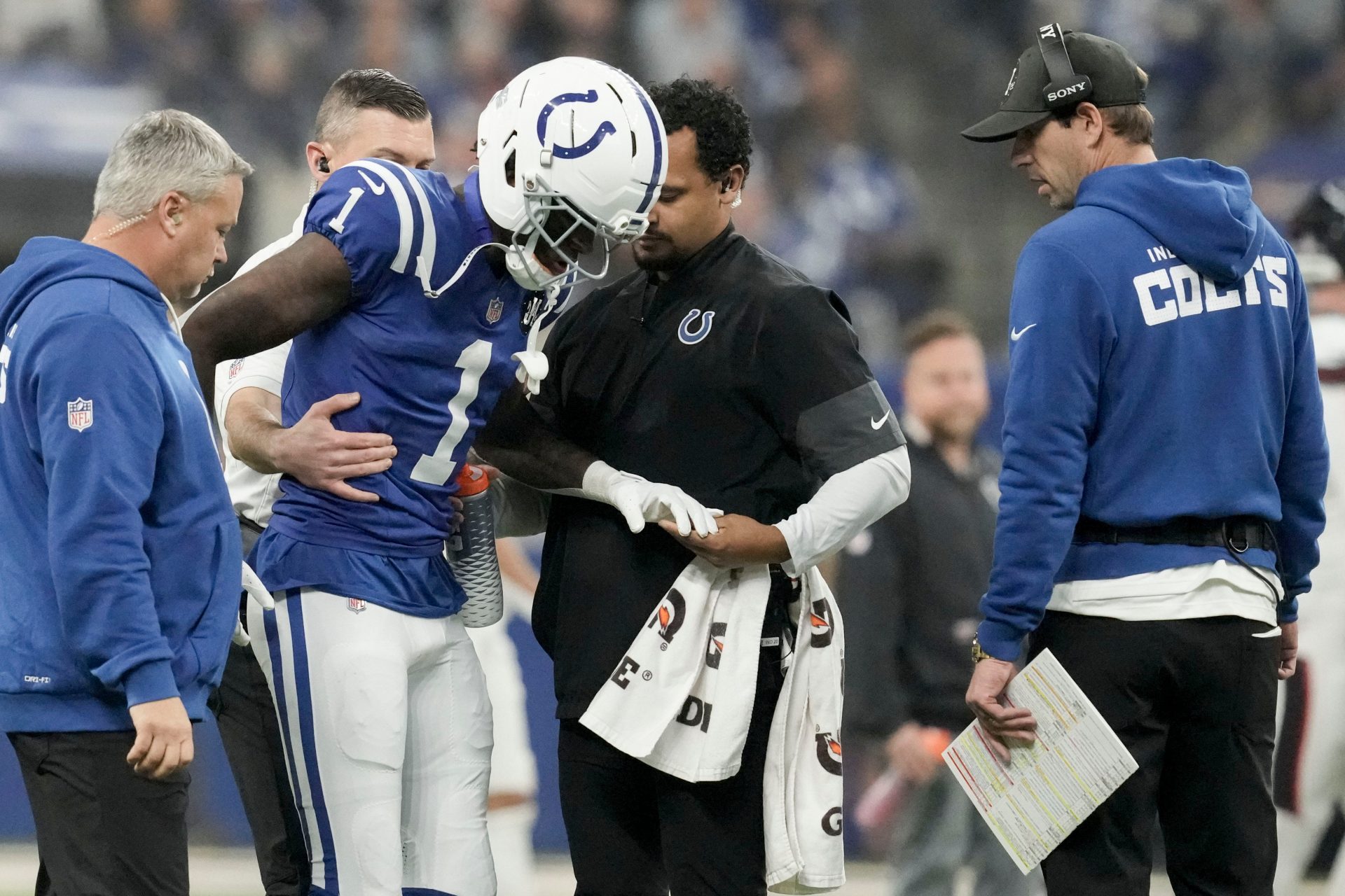 Indianapolis Colts cornerback Sauce Gardner (1) is helped off the field following an injury Sunday, Nov. 30, 2025, during a game against the Houston Texans at Lucas Oil Stadium in Indianapolis.