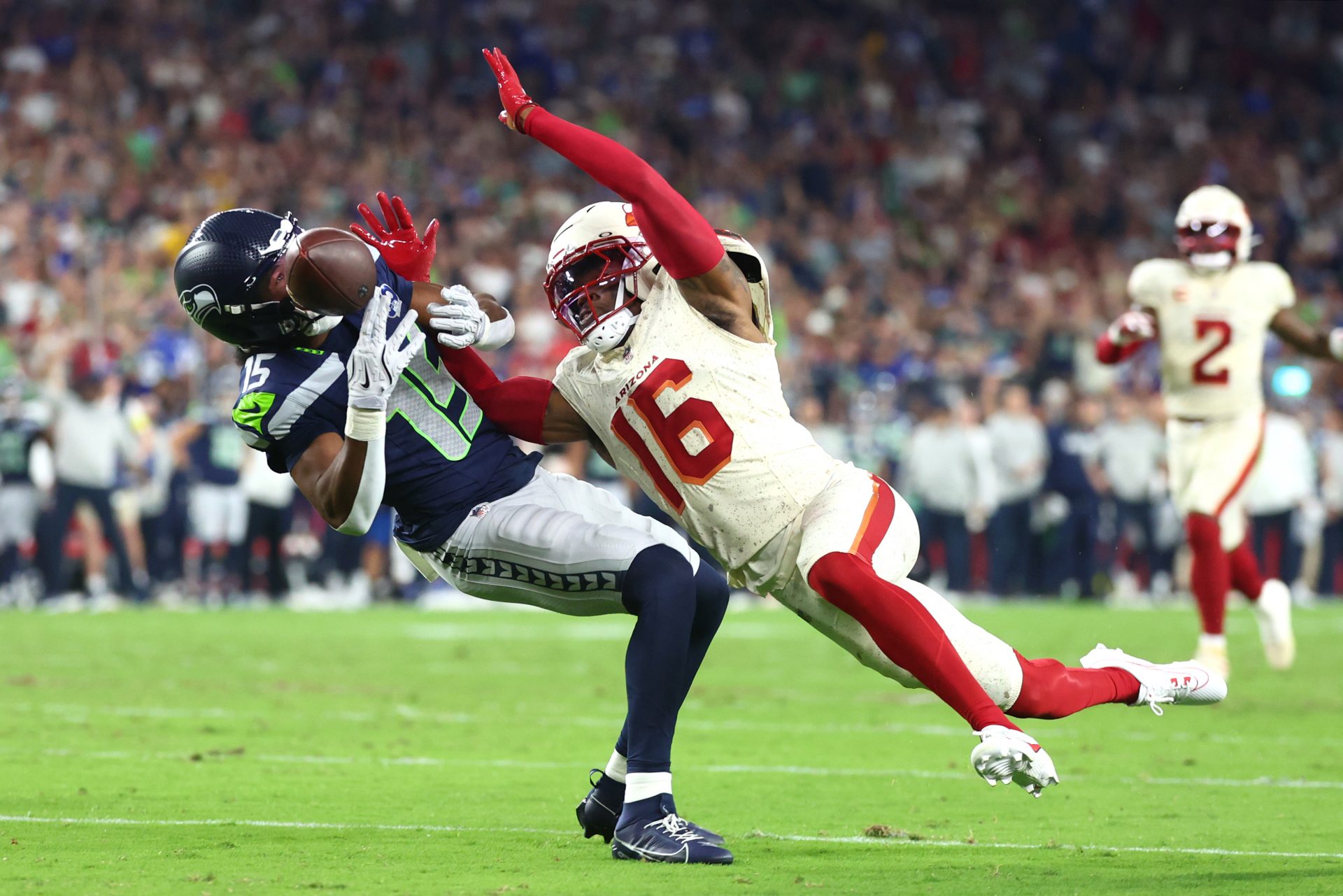 Seattle Seahawks wide receiver Tory Horton (15) cannot make a catch against Arizona Cardinals cornerback Max Melton (16) in the second quarter at State Farm Stadium.