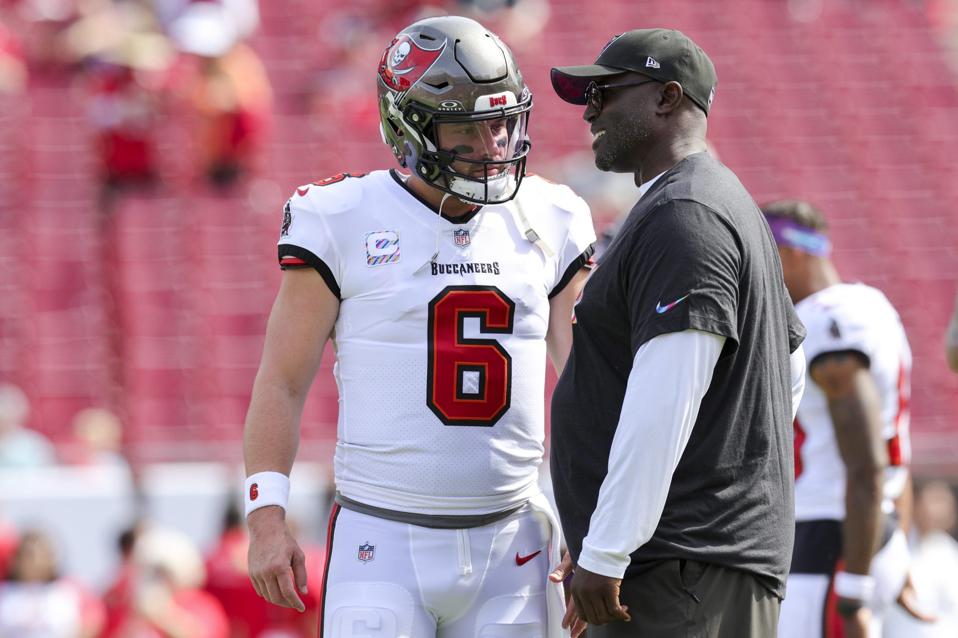Tampa Bay Buccaneers quarterback Baker Mayfield (6) speaks to head coach Todd Bowles before a game against the Atlanta Falcons at Raymond James Stadium.