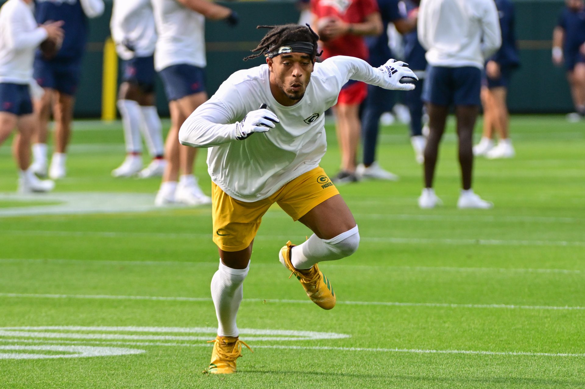 Green Bay Packers corner back Jaire Alexander (23) warms up before game against the New England Patriots at Lambeau Field.