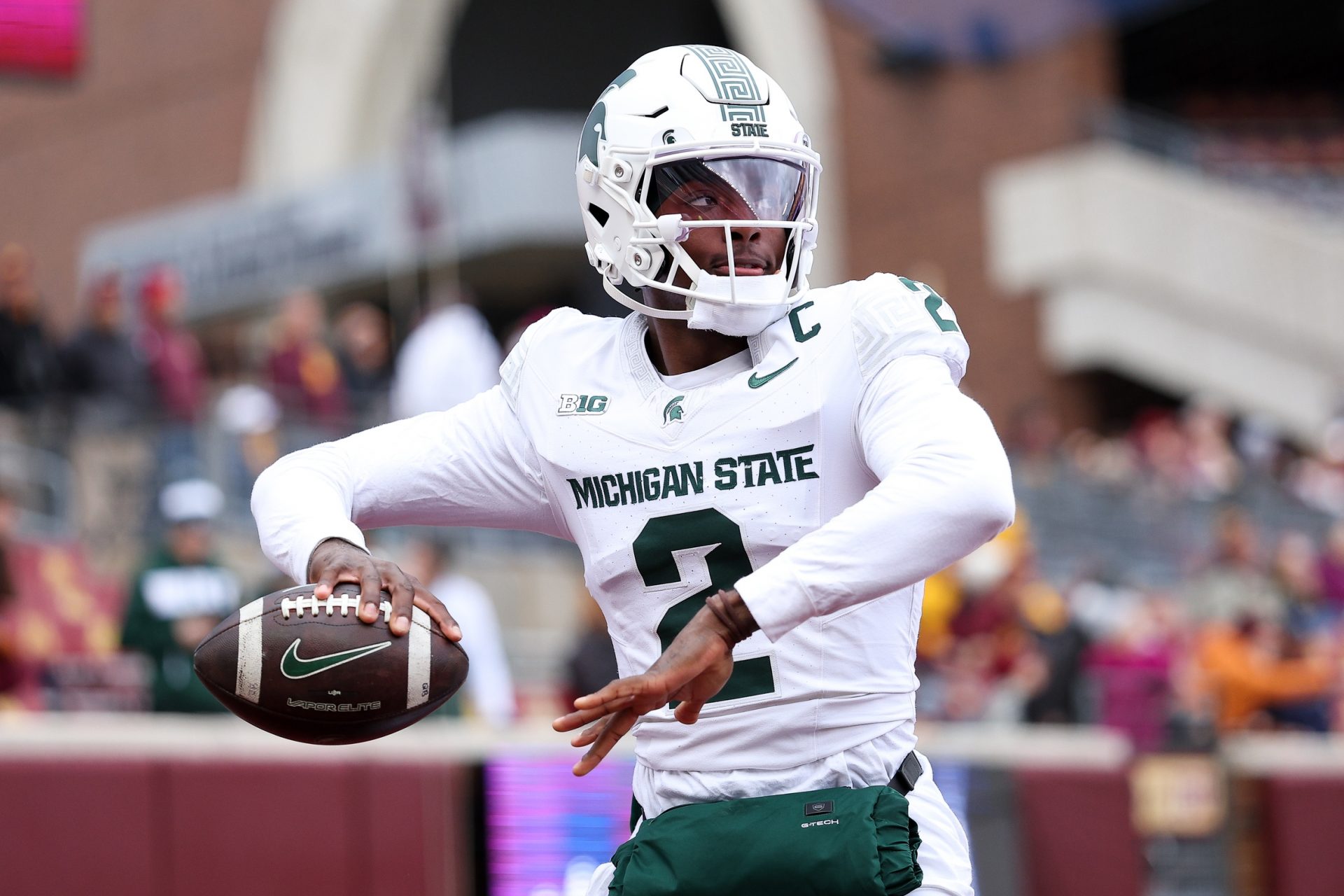 Michigan State Spartans quarterback Aidan Chiles (2) warms up before the game against the Minnesota Golden Gophers at Huntington Bank Stadium.