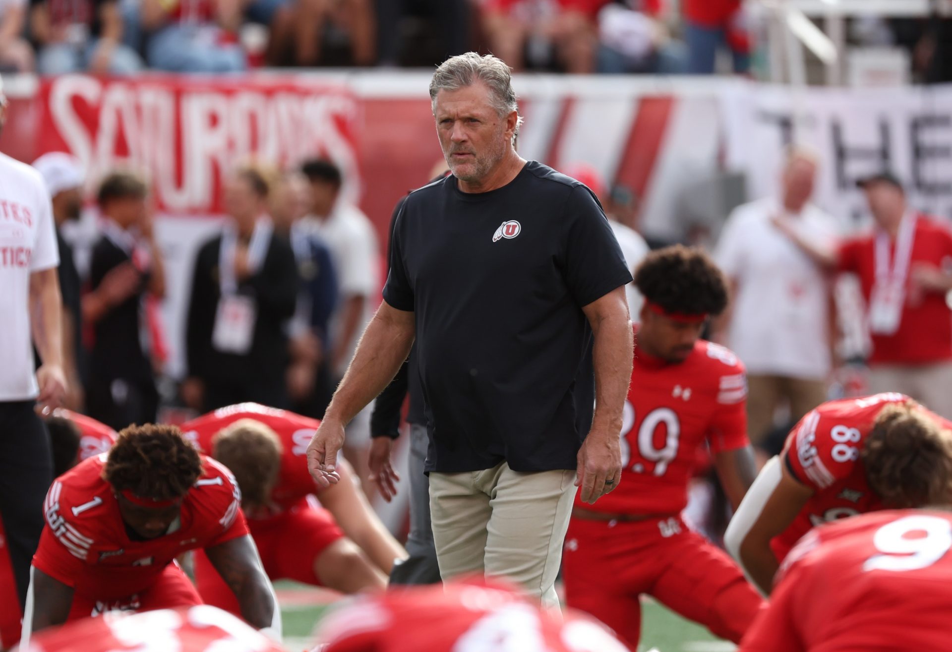 Utah Utes head coach Kyle Whittingham watches the team warm up before the game against the Texas Tech Red Raiders at Rice-Eccles Stadium.
