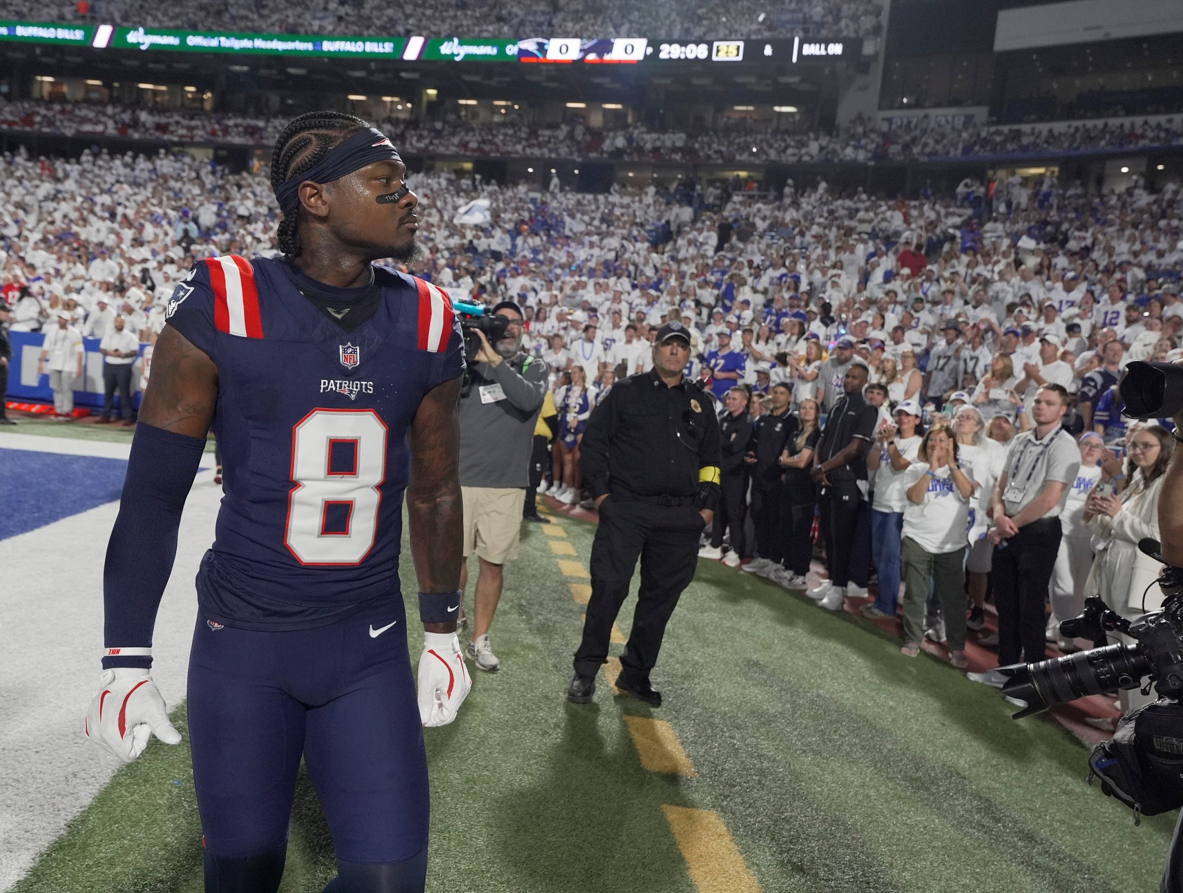 Stefon Diggs, a former Bills player, looks around at the crowd as the crowd has a mixed reaction to his return with another team before the Bills home game against the New England Patriots at Highmark Stadium in Orchard Park on Oct. 5, 2025.