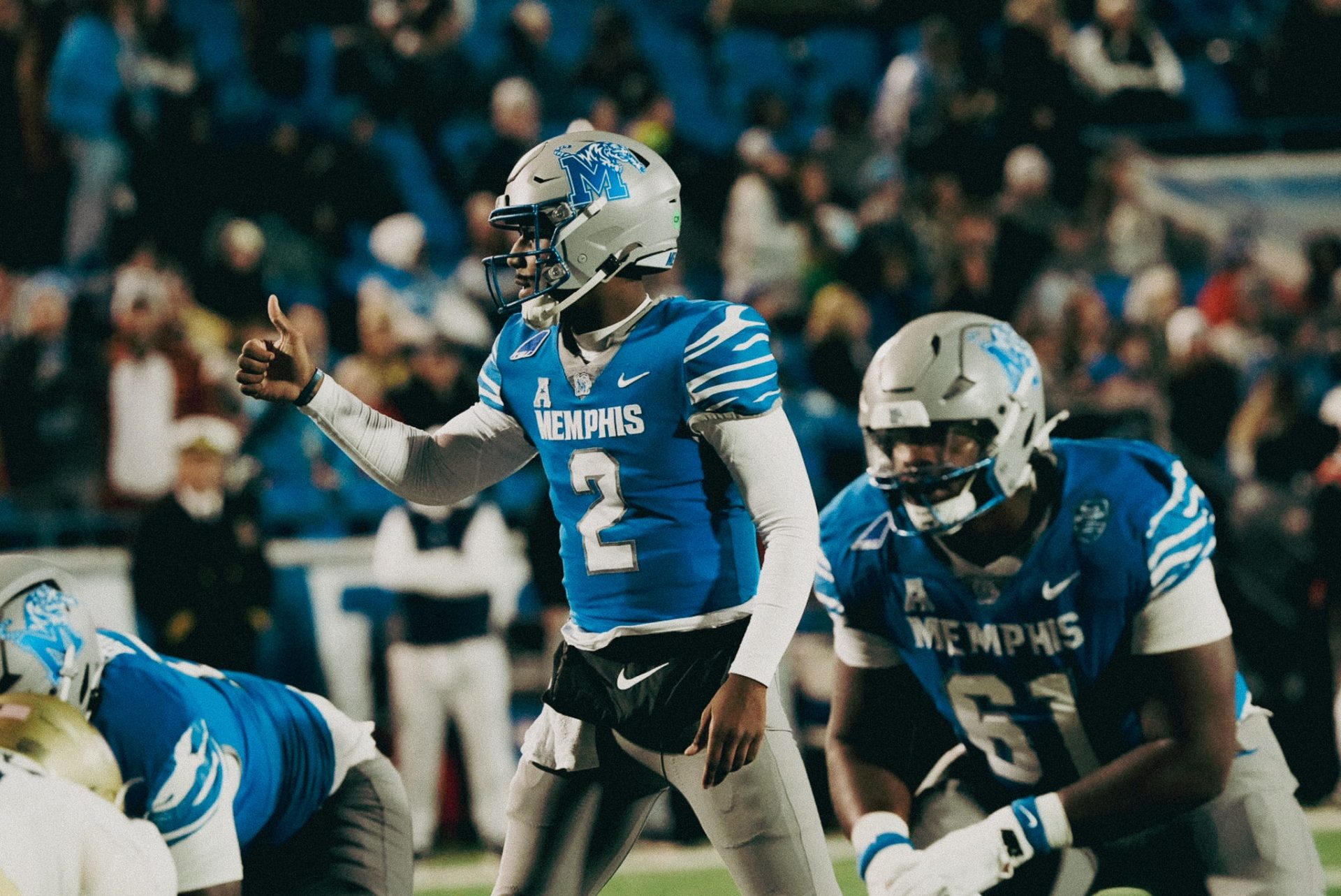 Memphis Tiger Brendon Lewis (2) signals teammates before a play against Navy during a game on Nov. 27, 2025 at Simmons Bank Liberty Stadium in Memphis, Tenn.