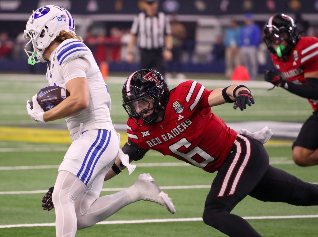 Texas Tech's John Curry attempts to make a tackle against BYU during the Big 12 Conference championship football game, Saturday, Nov. 6, 2025, at AT&T Stadium in Arlington.