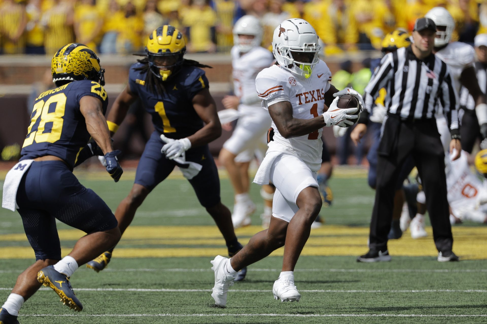 Texas Longhorns running back Quintrevion Wisner (26) rushes in the second half against the Michigan Wolverines at Michigan Stadium.