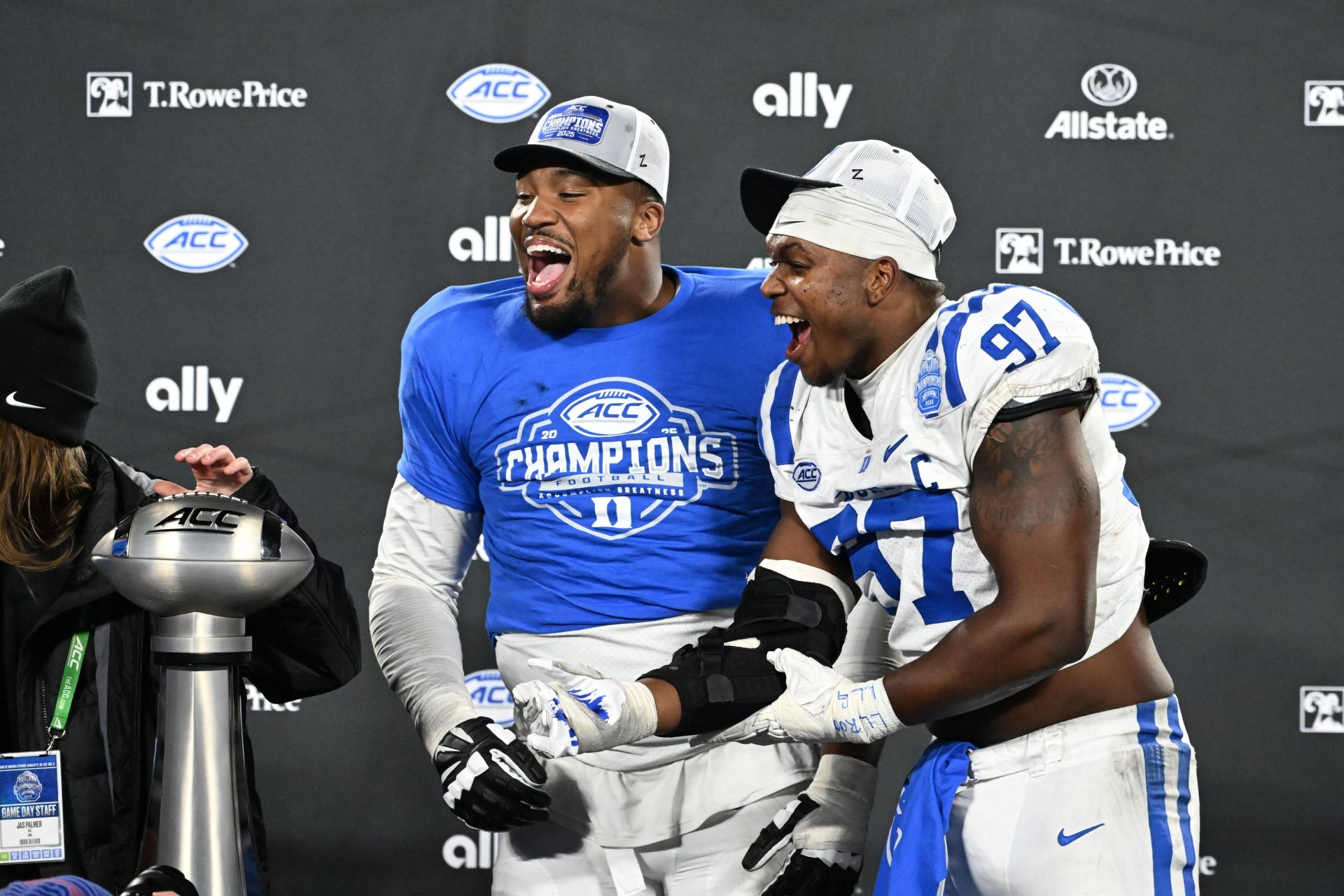 Duke Blue Devils defensive tackle Aaron Hall (99) and defensive end Wesley Williams (97) celebrate after winning the  ACC Championship game at Bank of America Stadium.