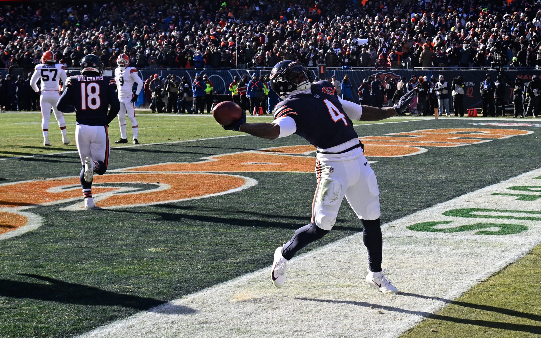 Chicago Bears running back D'Andre Swift (4) celebrates after scoring a touchdown during the first quarter against the Cleveland Browns at Soldier Field.