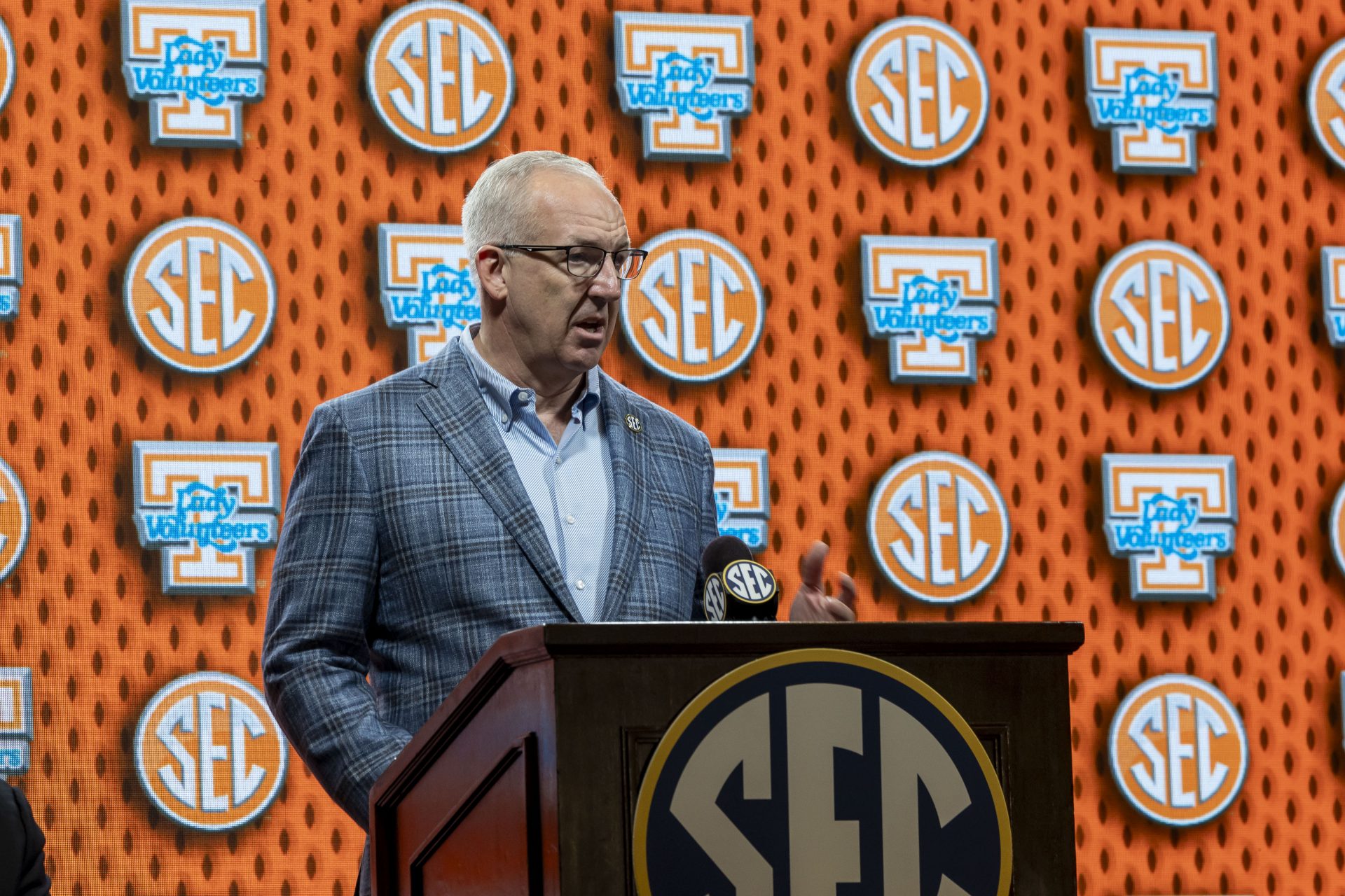 SEC commissioner Greg Sankey introduces Tennessee Volunteers head coach Kim Caldwell at during SEC Media Days at Grand Bohemian Hotel.