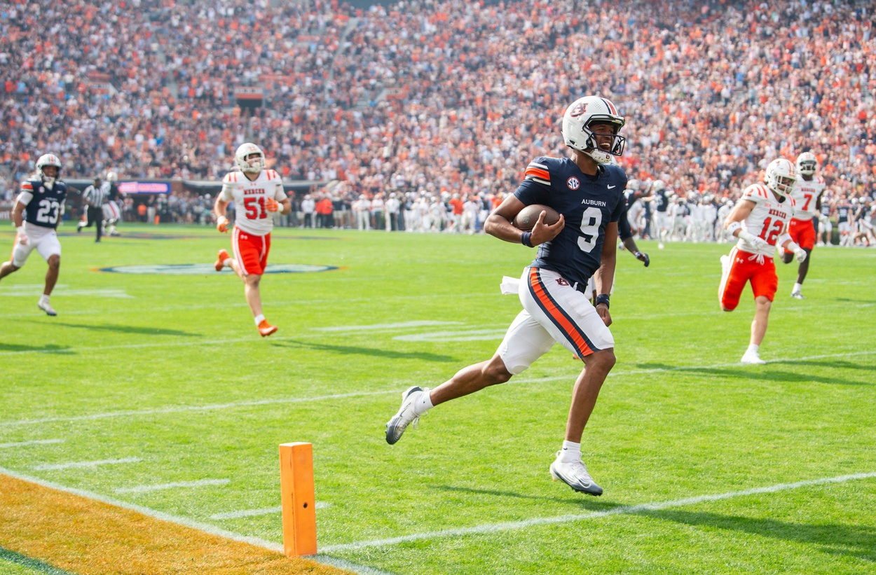 Auburn Tigers quarterback Deuce Knight (9) run in for a touchdown on the first play of the game as Auburn Tigers take on Mercer Bears at Jordan-Hare Stadium in Auburn, Ala. on Saturday, Nov. 22, 2025.