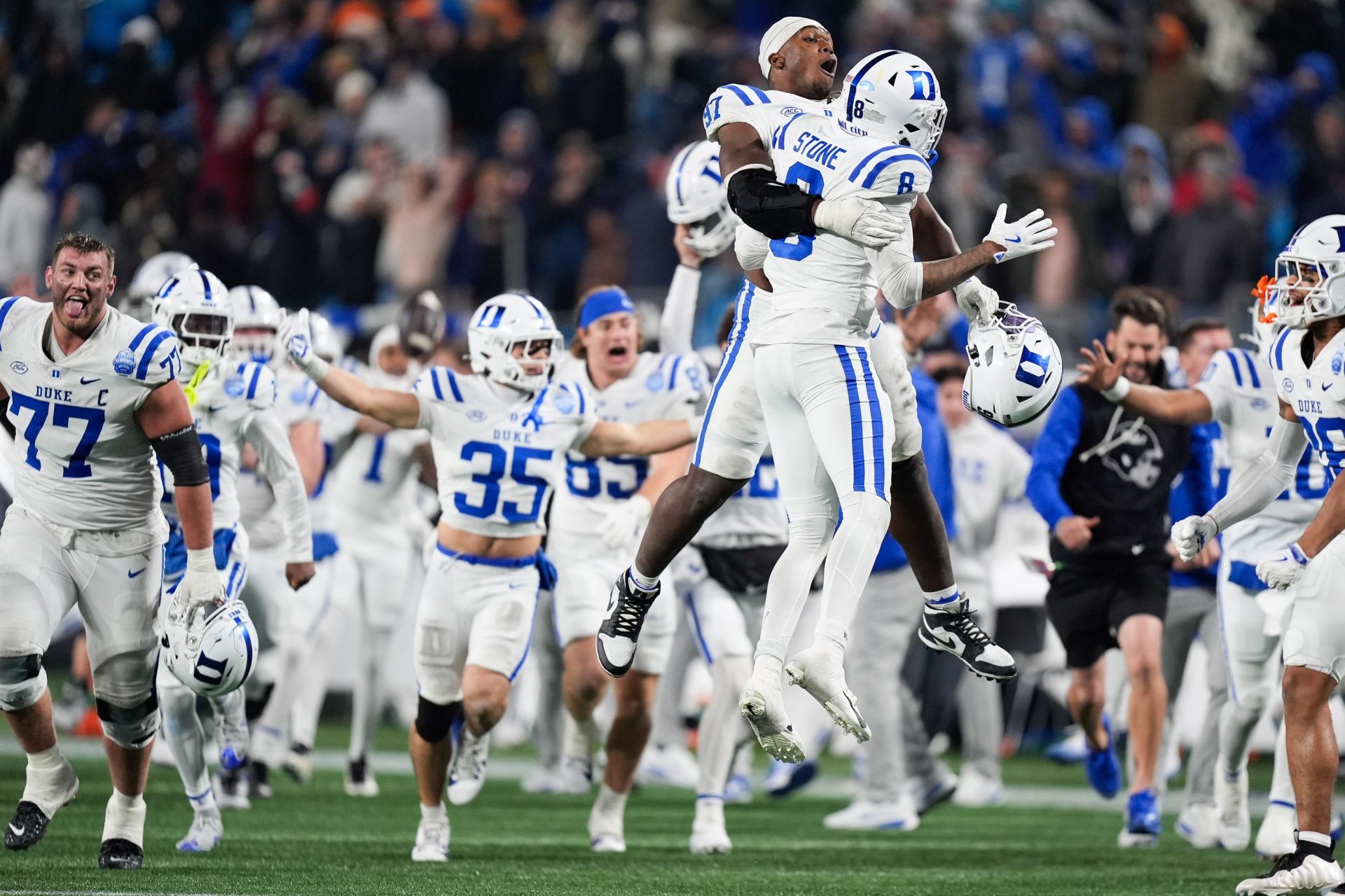 Duke Blue Devils defensive end Wesley Williams (97) celebrates with safety DaShawn Stone (8) after defeating the Virginia Cavaliers during the 2025 ACC Championship game at Bank of America Stadium.