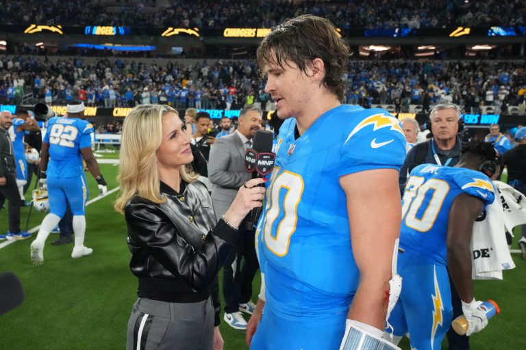 ESPN sideline reporter Laura Rutledge (left) interviews Los Angeles Chargers quarterback Justin Herbert (10) after the game against the Philadelphia Eagles at SoFi Stadium.