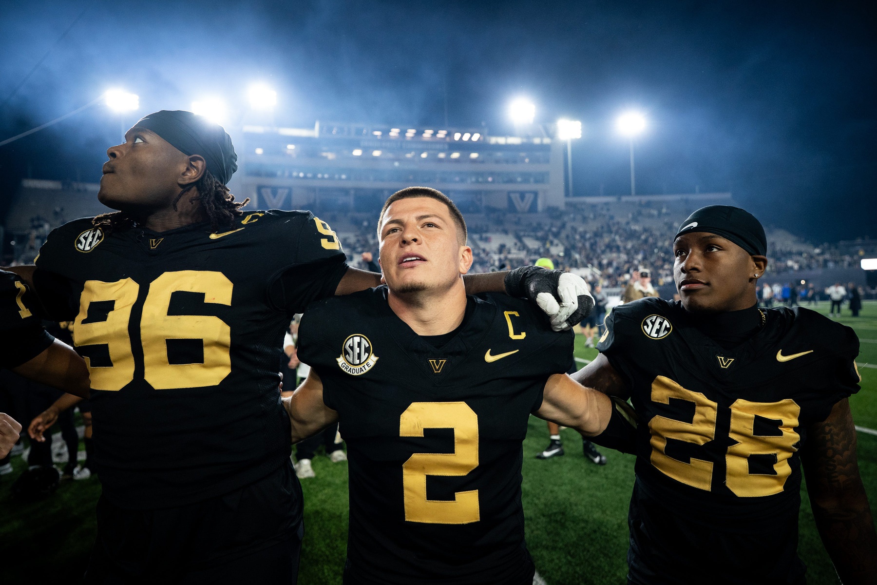 Vanderbilt quarterback Diego Pavia celebrates with defensive lineman Khordae Sydnor (96) and running back Sedrick Alexander (28) after defeating Kentucky at FirstBank Stadium in Nashville, Tenn., Saturday, Nov. 22, 2025.