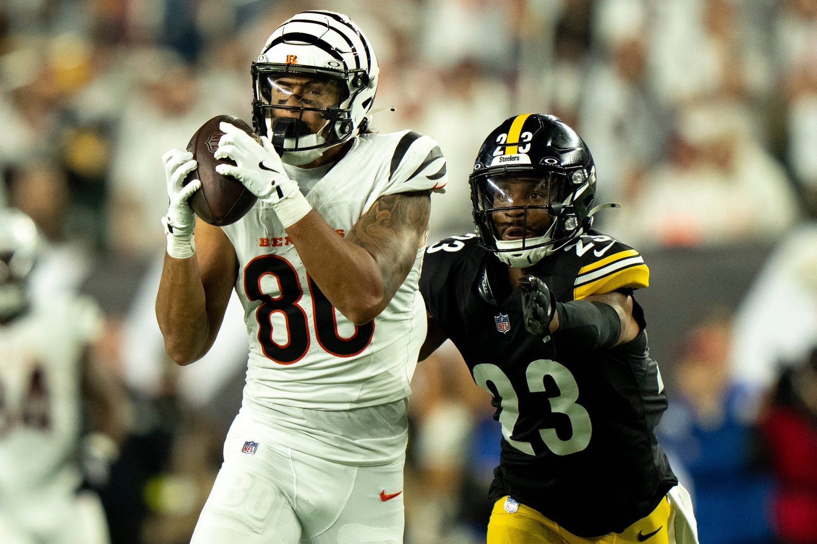 Cincinnati Bengals wide receiver Andrei Iosivas (80) catches a pass as Pittsburgh Steelers cornerback Darius Slay (23) defends in the third quarter of the NFL game between the Cincinnati Bengals and Pittsburgh Steelers at Paycor Stadium in Cincinnati on Oct. 16, 2025.