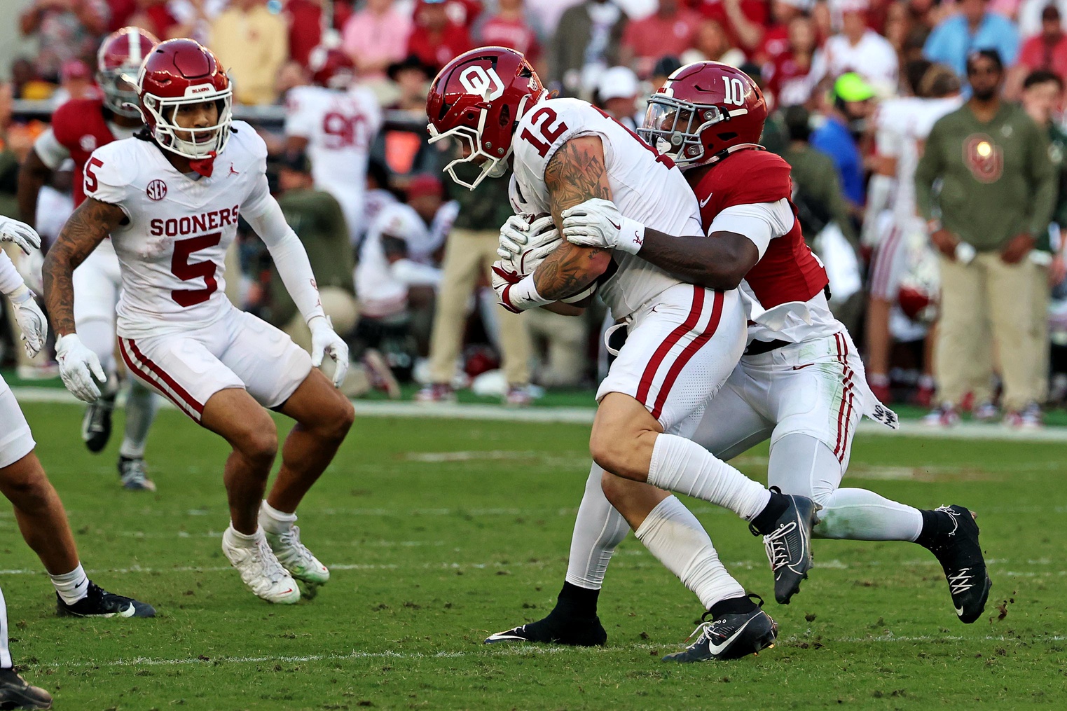 Oklahoma Sooners tight end Jaren Kanak (12) is tackled by Alabama Crimson Tide linebacker Justin Jefferson (10) during the first half at Saban Field at Bryant-Denny Stadium.