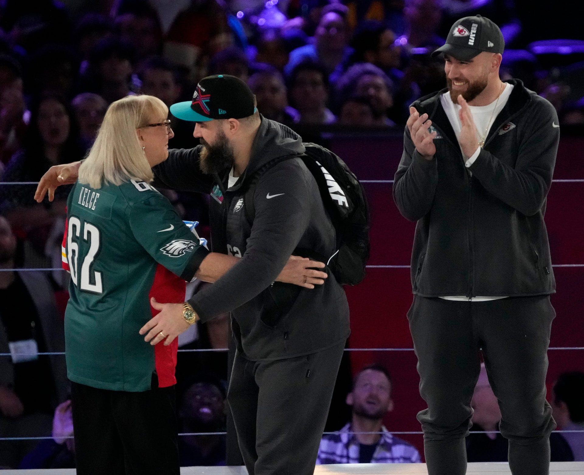 Donna Kelce hugs her son Philadelphia Eagles center Jason Kelce (62) while her other son Kansas City Chiefs tight end Travis Kelce (87) claps at the Footprint Center in downtown Phoenix during the NFL's Super Bowl Opening Night on Feb. 6, 2023.

Nfl Super Bowl Lvii Opening Night Kansas City Chiefs