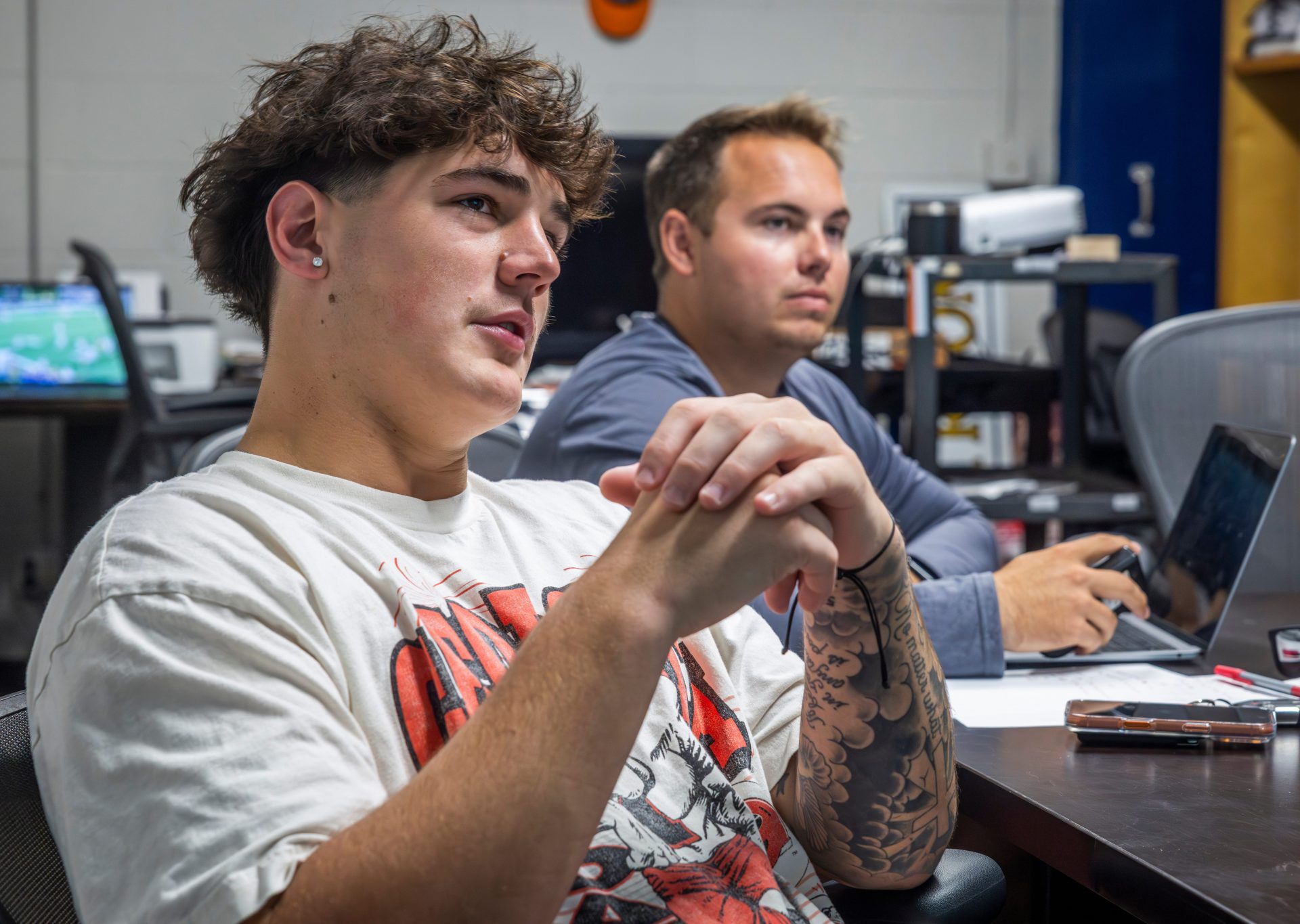 Nashville Christian quarterback Jared Curtis, left, reviews film with offensive coordinator Kyle Tidwell at the team’s locker room Tuesday, Oct. 14, 2025.