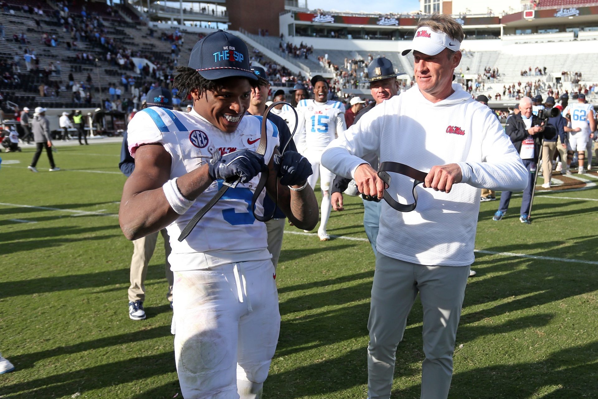 Mississippi Rebels running back Kewan Lacy (5) and head coach Lane Kiffin celebrate after defeating against the Mississippi State Bulldogs at Davis Wade Stadium at Scott Field.