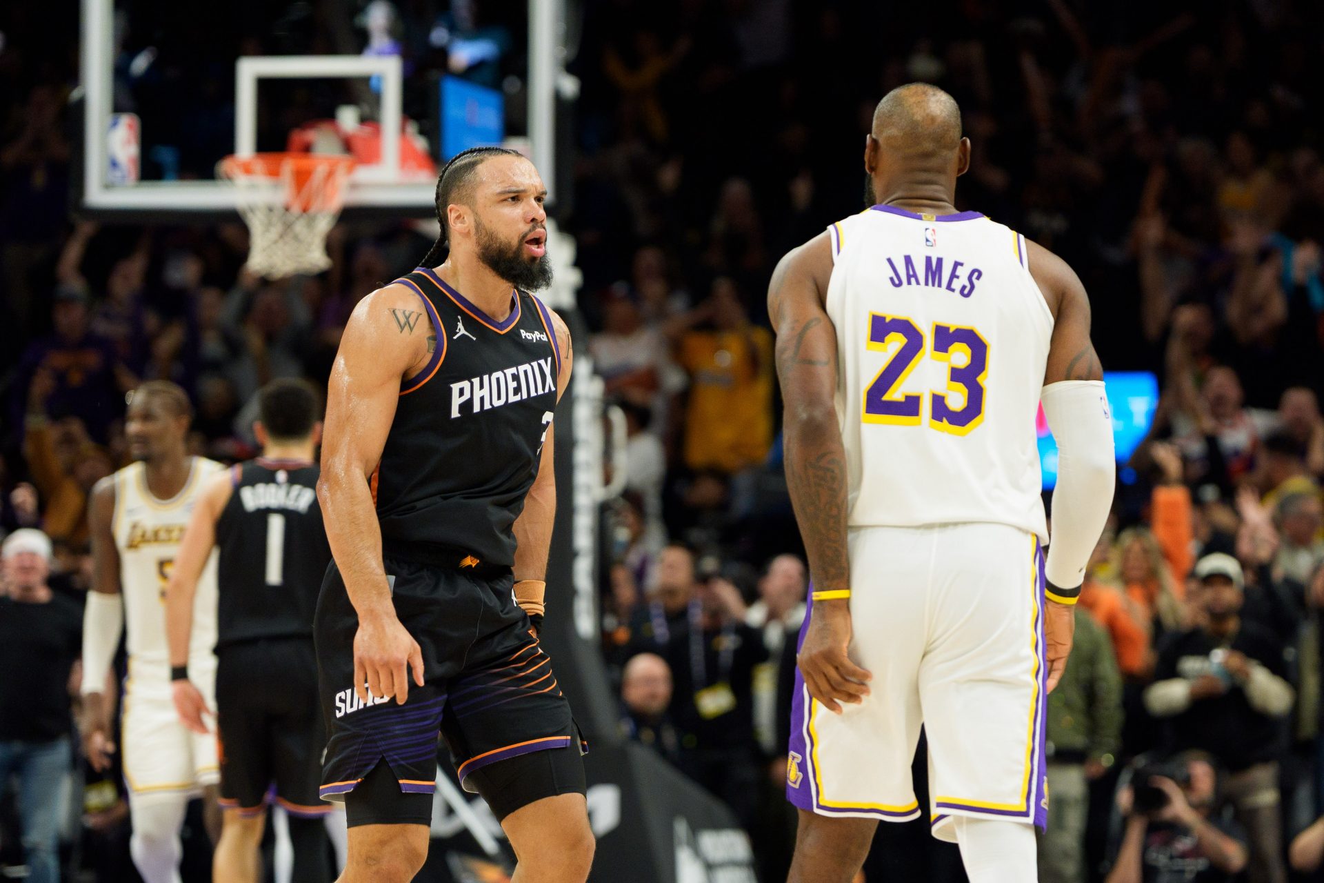 Phoenix Suns forward Dillon Brooks (3) and Los Angeles Lakers forward LeBron James (23) react during an altercation that resulted in a technical for Brooks during the second half of a game at at Mortgage Matchup Center.
