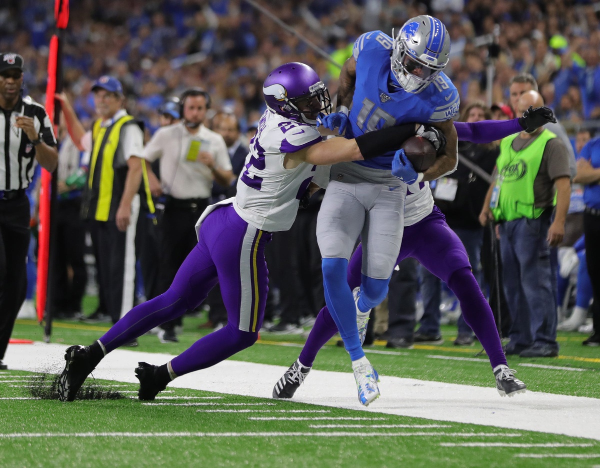 Detroit Lions receiver Kenny Golladay is tackled by Minnesota Vikings safety Harrison Smith during the second half Sunday, Oct. 20, 2019 at Ford Field.

Lions Vs Minnesota