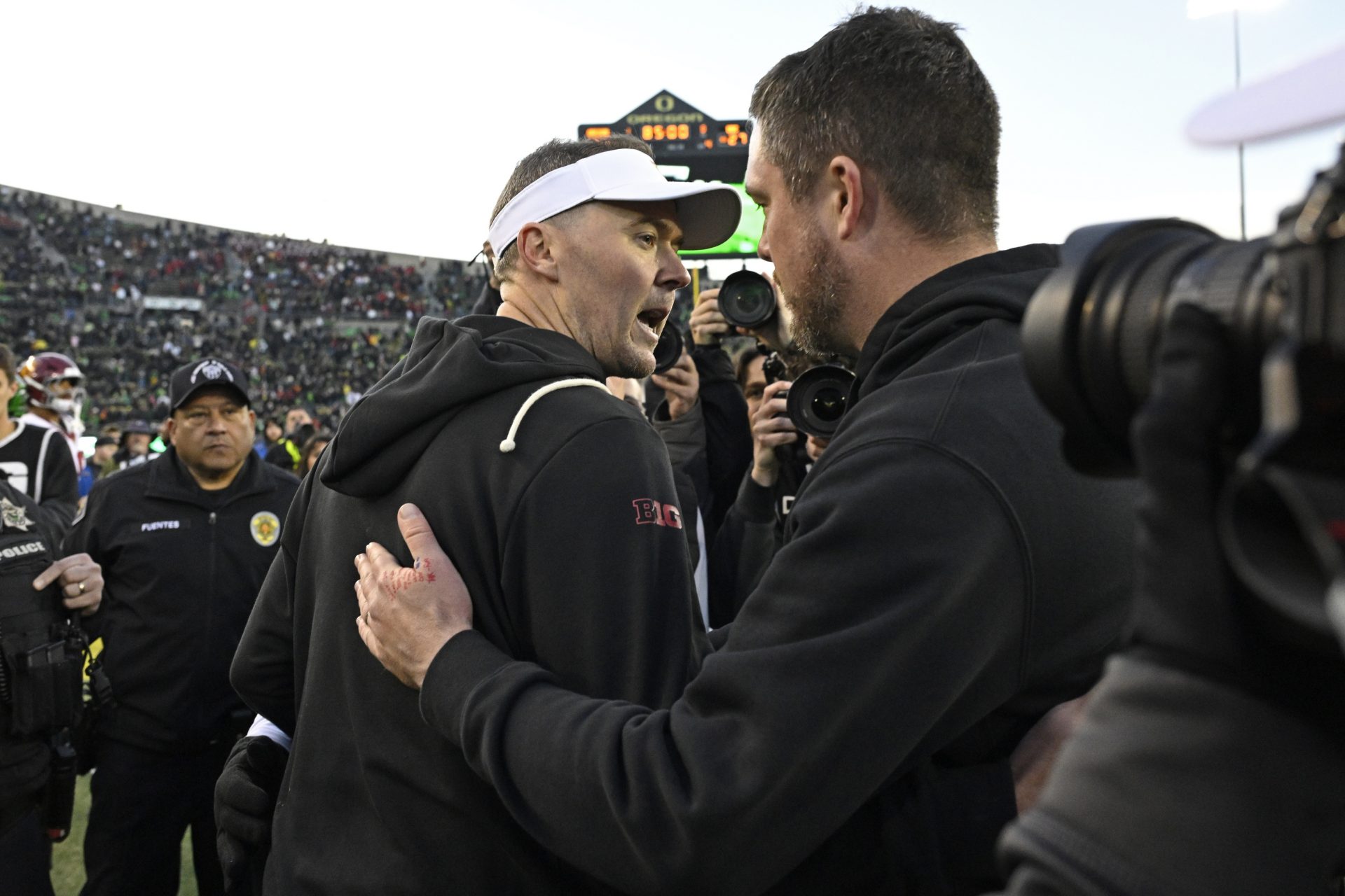 Southern California Trojans head coach Lincoln Riley and Oregon Ducks head coach Dan Lanning greet each other after the game at Autzen Stadium.