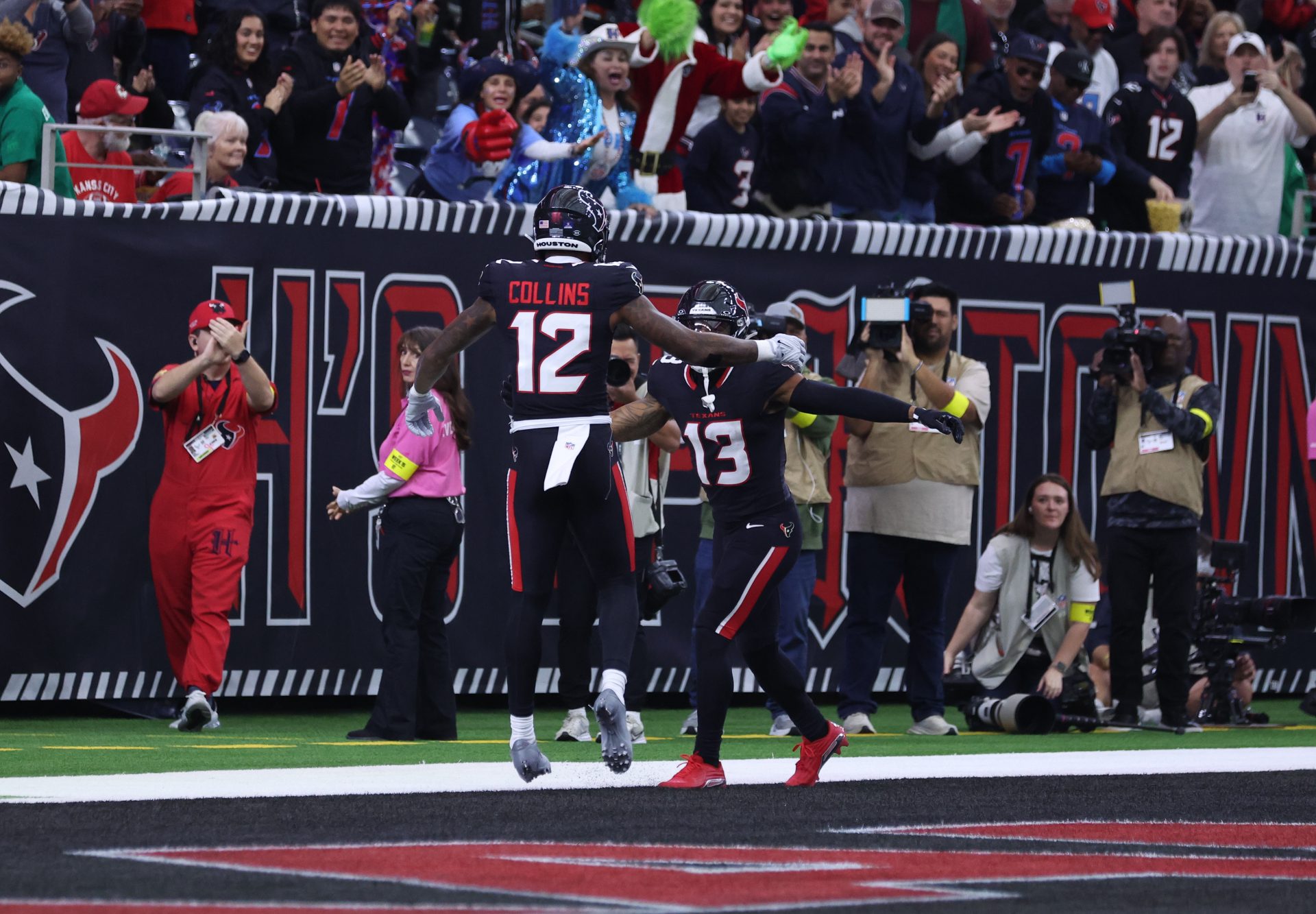 Houston Texans wide receiver Nico Collins (12) and wide receiver Christian Kirk (13) celebrate a touchdown during the first quarter against the Arizona Cardinals at NRG Stadium.