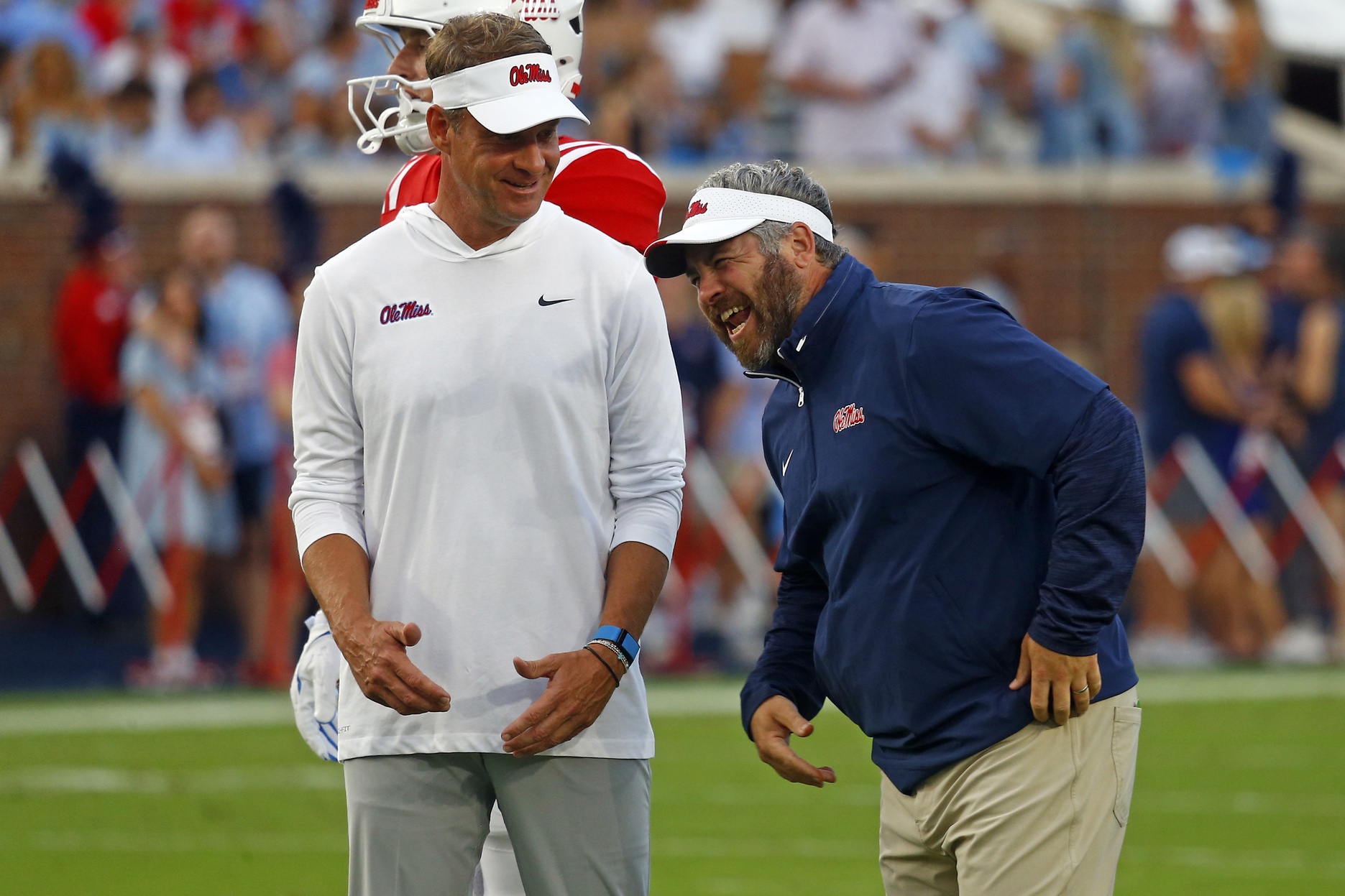 Mississippi Rebels head coach Lane Kiffin (left) shares a laugh with defensive coordinator Pete Golding (right) during warm ups prior to the game against the Georgia Southern Eagles at Vaught-Hemingway Stadium.