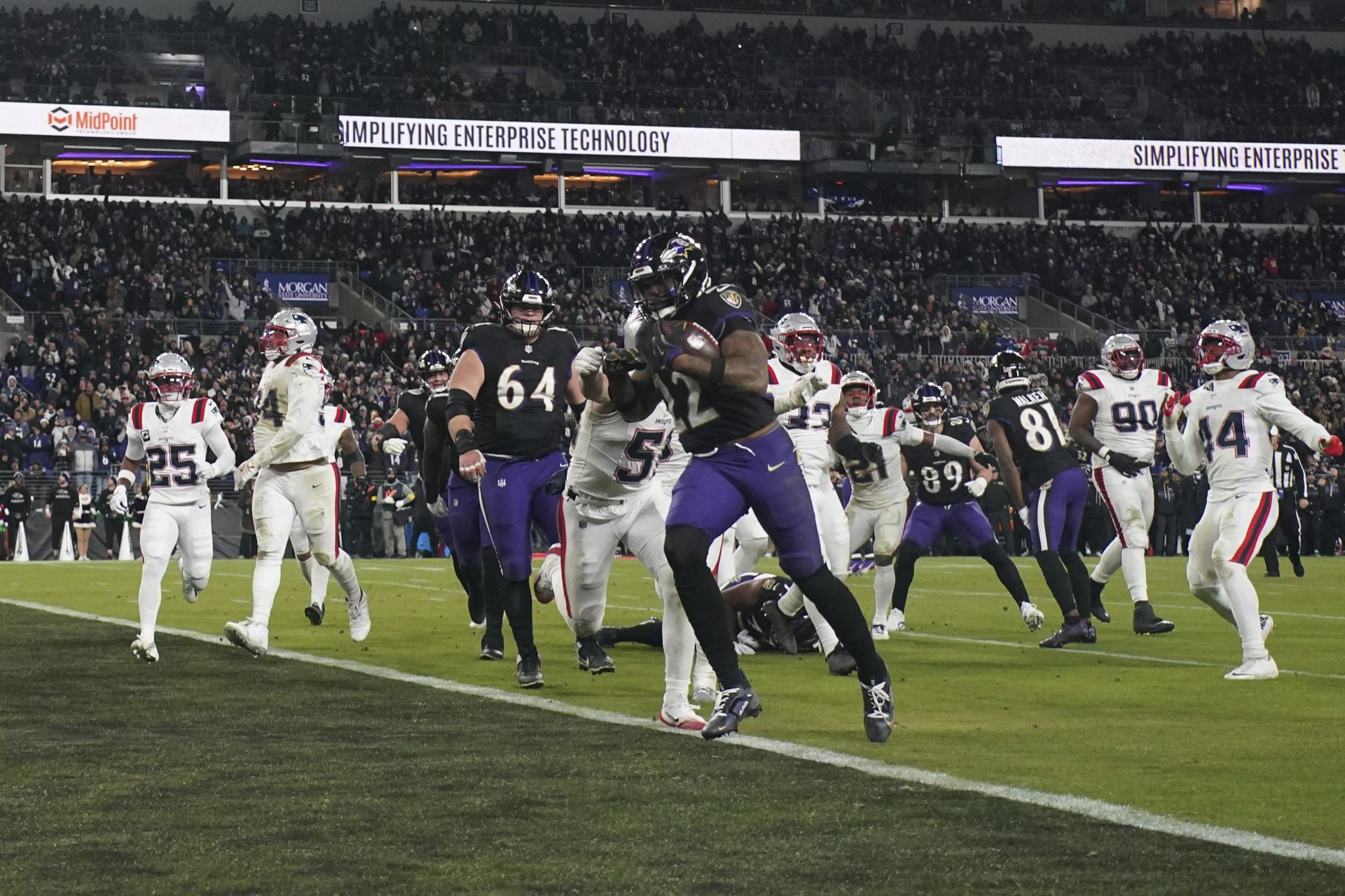 Baltimore Ravens running back Derrick Henry (22) runs for a touchdown against the New England Patriots during the second half of the game at M&T Bank Stadium.