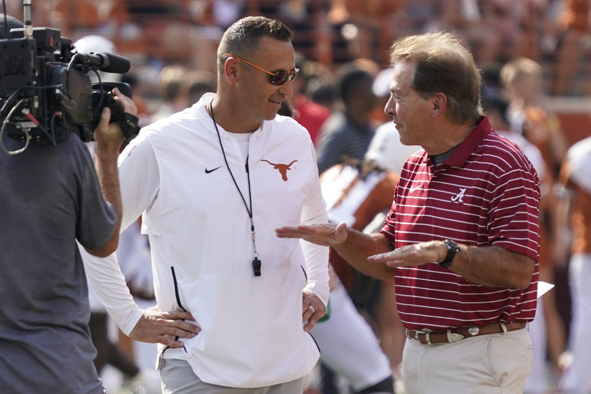 Texas Longhorns head coach Steve Sarkisian talks with Alabama Crimson Tide head coach Nick Saban before the game at Darrell K Royal-Texas Memorial Stadium.