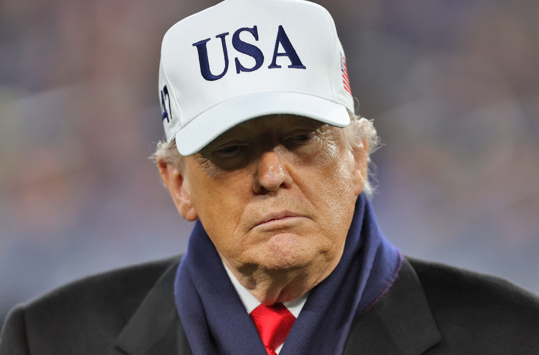 President Donald J. Trump stands on the field during the first half of the 126th Army-Navy game at M&T Bank Stadium.