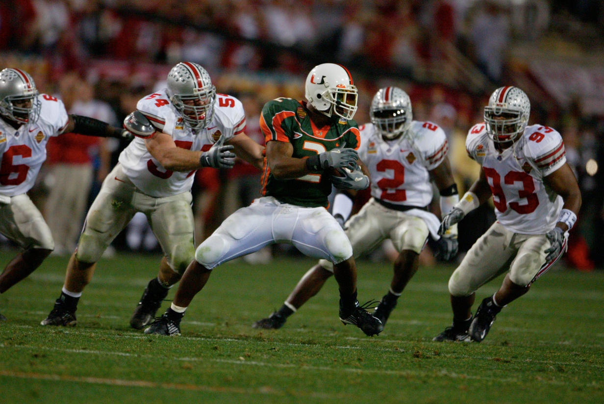 Willis McGahee of Miami gets tackles by Ohio State's Tim Anderson after a catch in the fourth quarter of the National Football Championships at the Sun Devil Stadium in Tempe, Arizona, January 3, 2003.