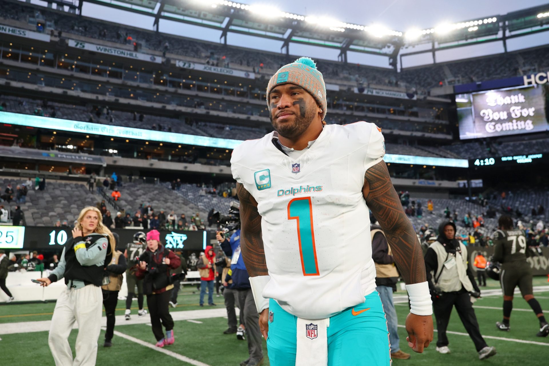 Miami Dolphins quarterback Tua Tagovailoa (1) walks on the field after the game against the New York Jets at MetLife Stadium.