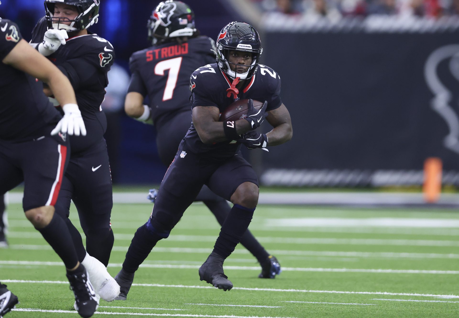 Houston Texans running back Woody Marks (27) runs with the ball during the first quarter against the Arizona Cardinals at NRG Stadium.