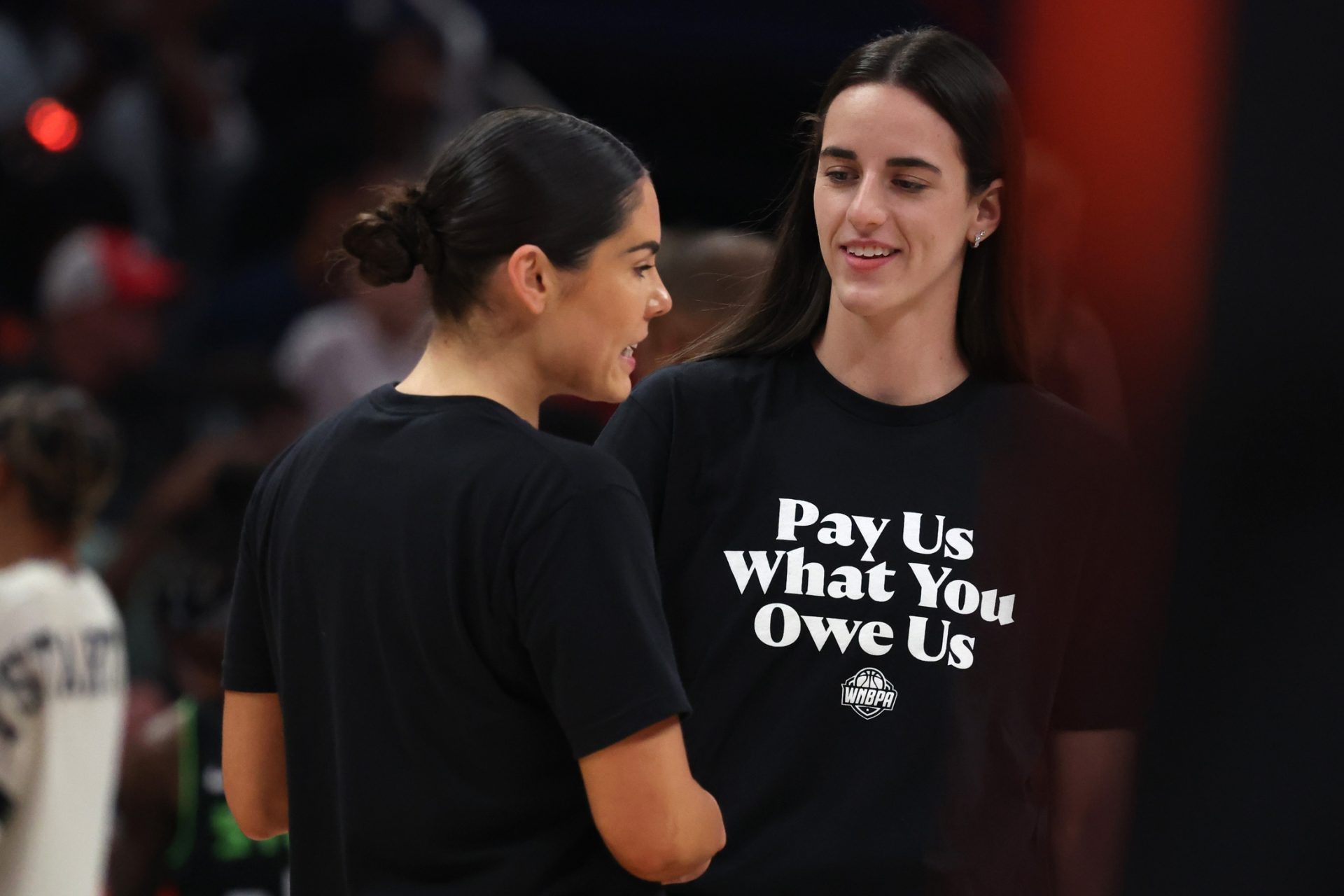 Team Clark guard Caitlin Clark (22) and Team Collier guard Kelsey Plum (10) before the 2025 WNBA All Star Game at Gainbridge Fieldhouse.