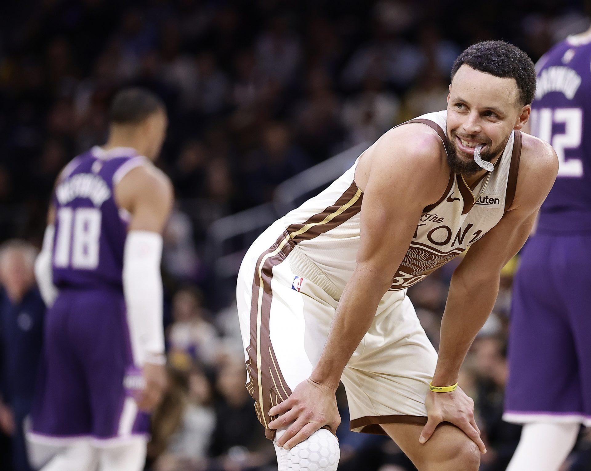 Golden State Warriors guard Stephen Curry (30) smiles as a call is reviewed for a flagrant foul against Sacramento Kings guard Russell Westbrook (18) during the fourth quarter at Chase Center.