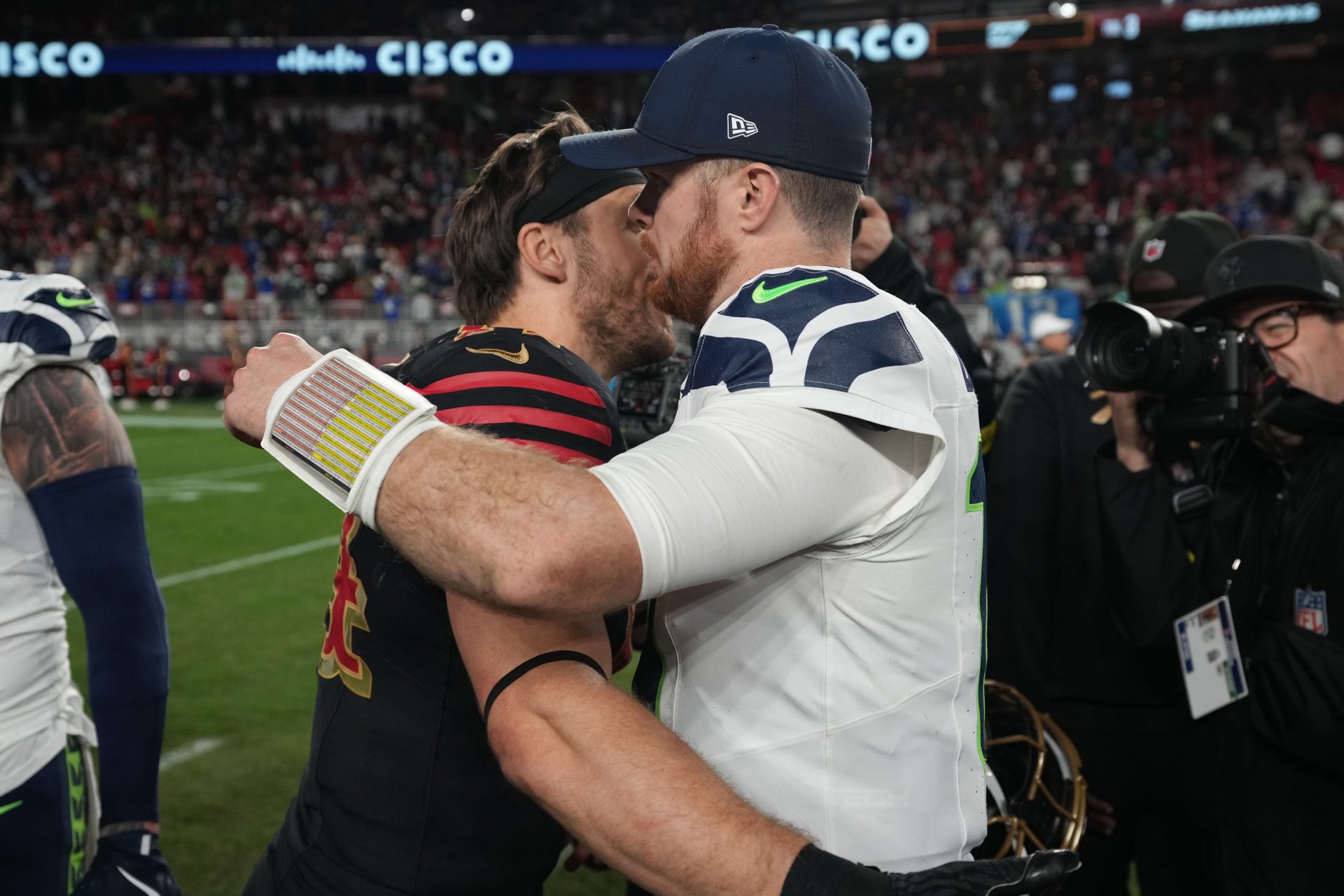 Seattle Seahawks quarterback Sam Darnold (14) reacts with San Francisco 49ers fullback Kyle Juszczyk (44) after the game at Levi's Stadium.
